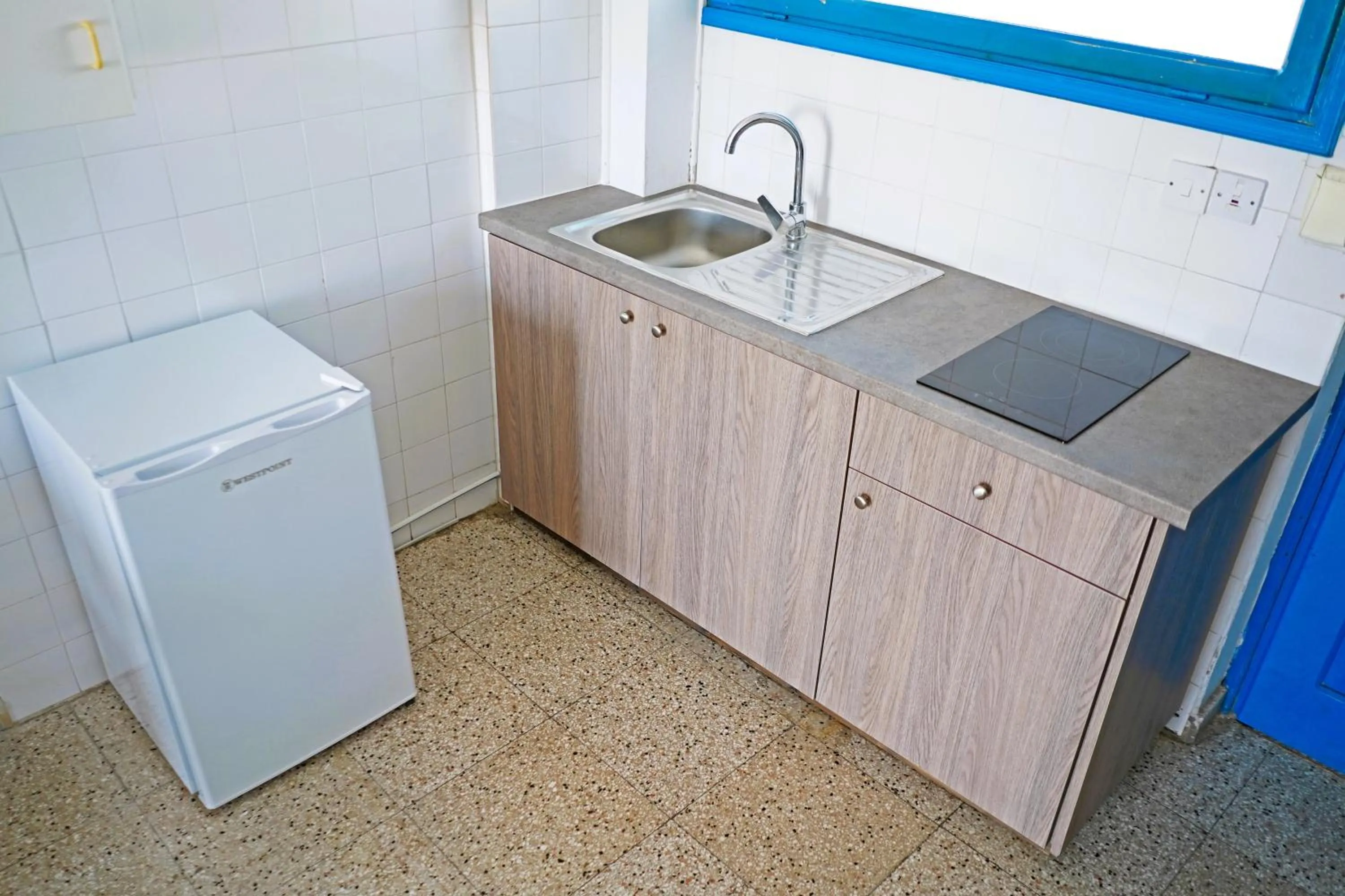 Kitchen or kitchenette in Green Bungalows Hotel Apartments - Residents Only