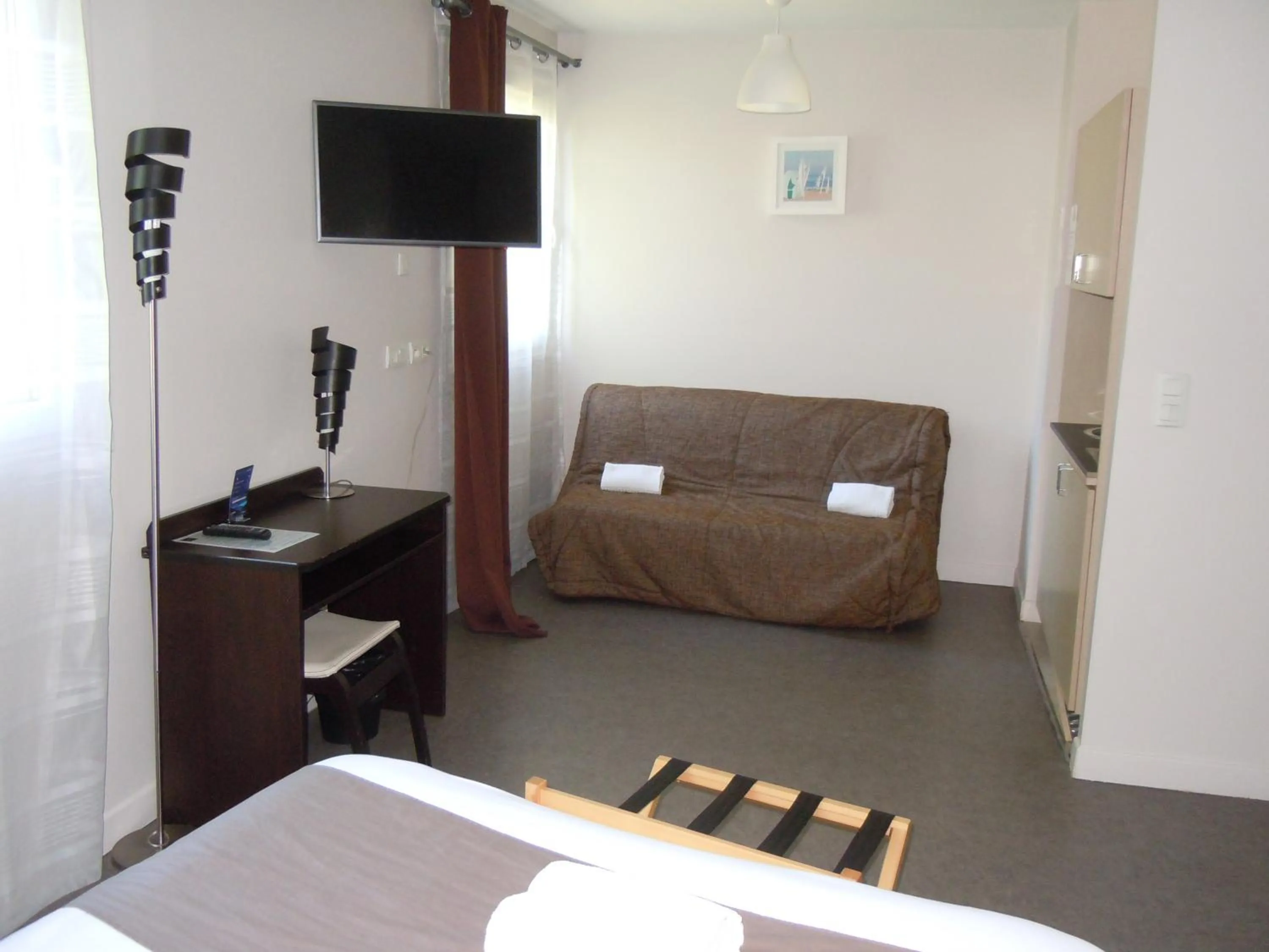 Bed in Sweet Home Appart'Hôtel Deauville Sud