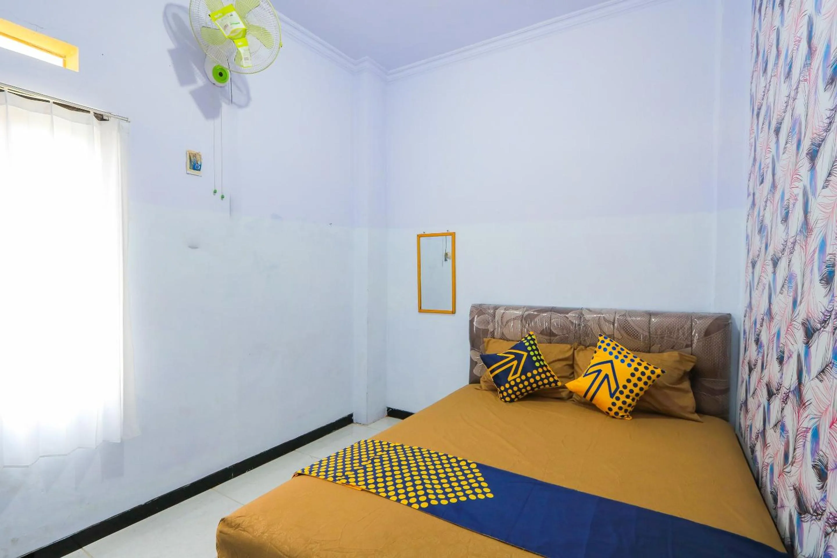 Bedroom in OYO 2497 Pesona Guest House