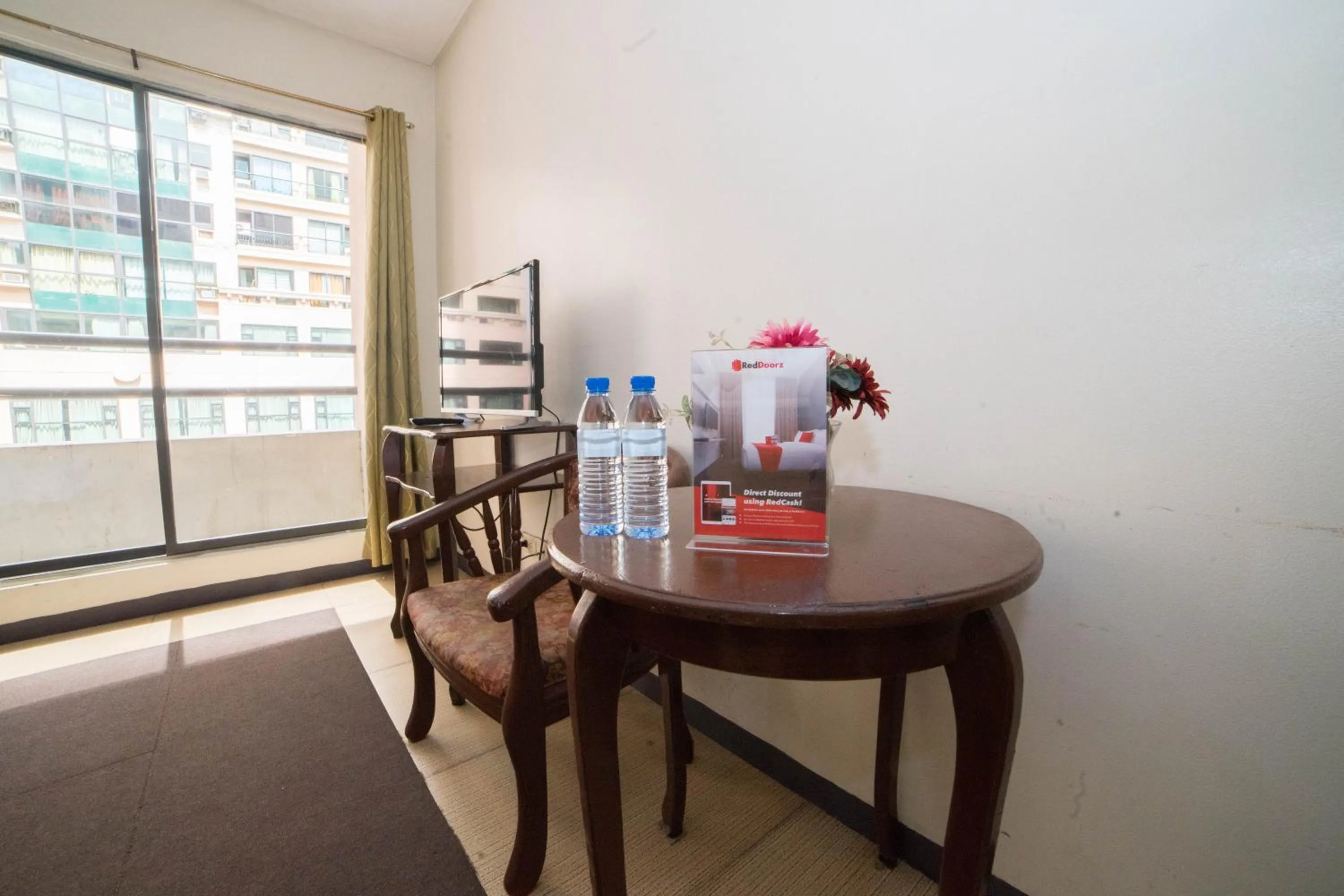 Bedroom, Dining Area in RedDoorz at Bel Air Soho Suites Makati City