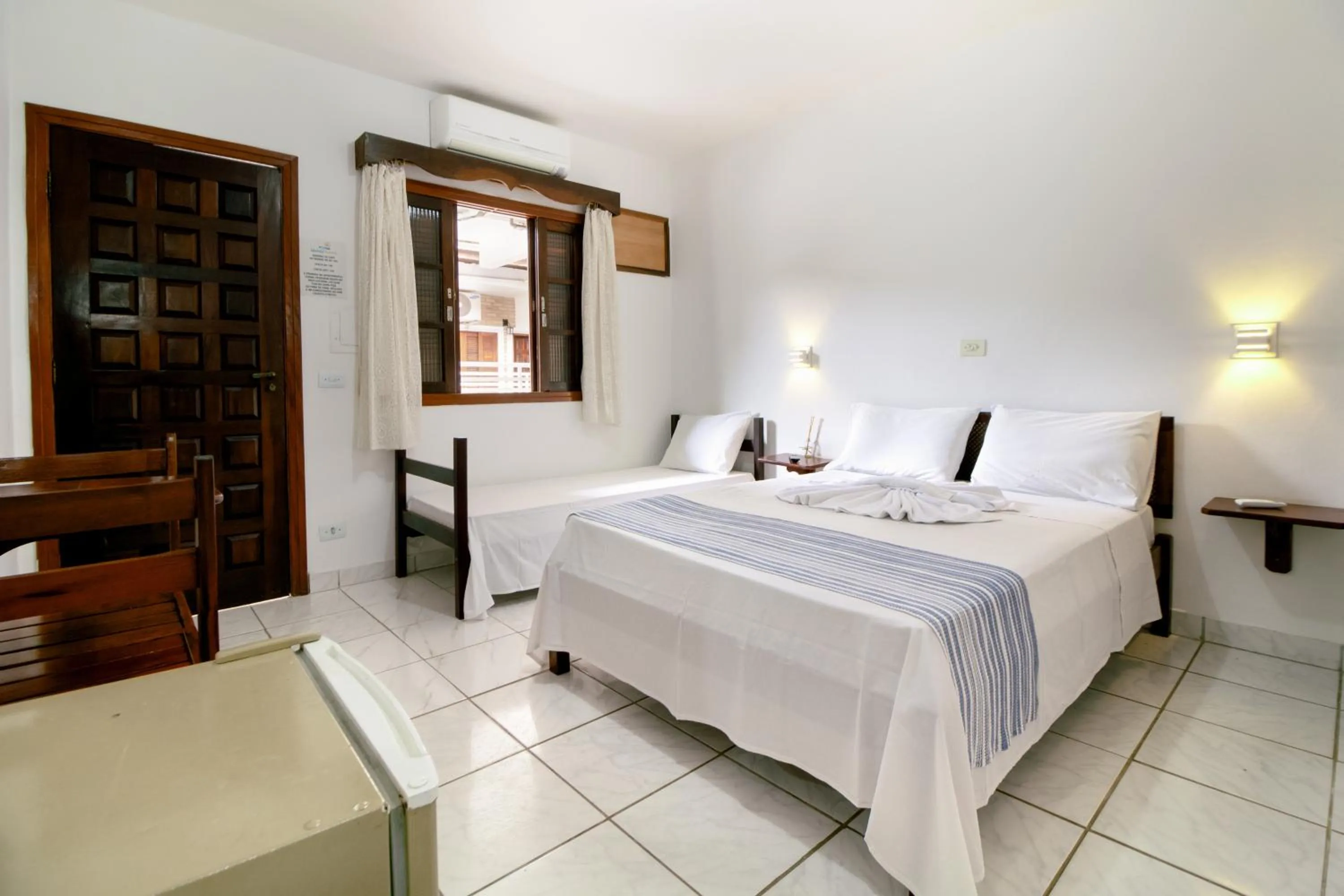 Bed in VELINN Pousada Ubatuba Tropical