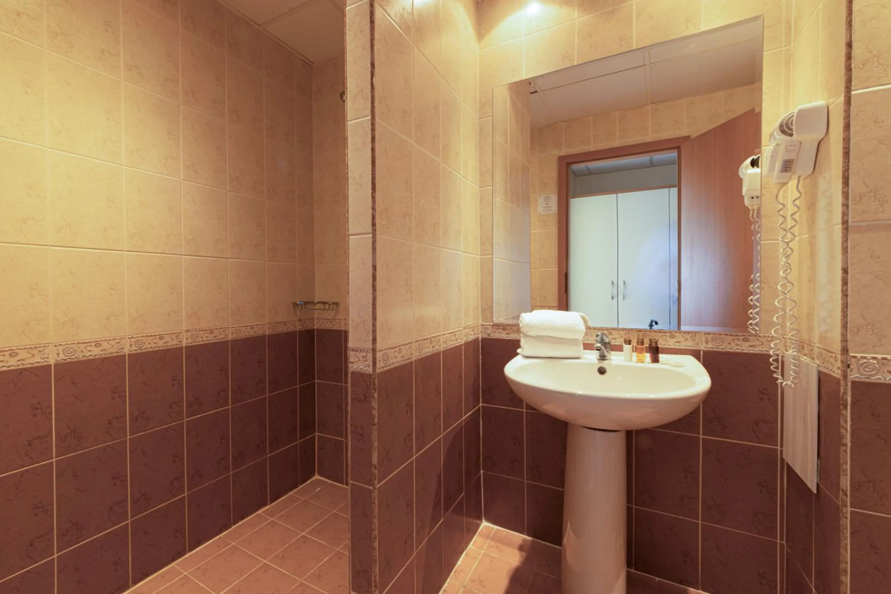 Bathroom in Helios Spa Hotel- All Inclusive , Newly Refurbished Rooms with Private AC, Pools and Water Fun for Kids