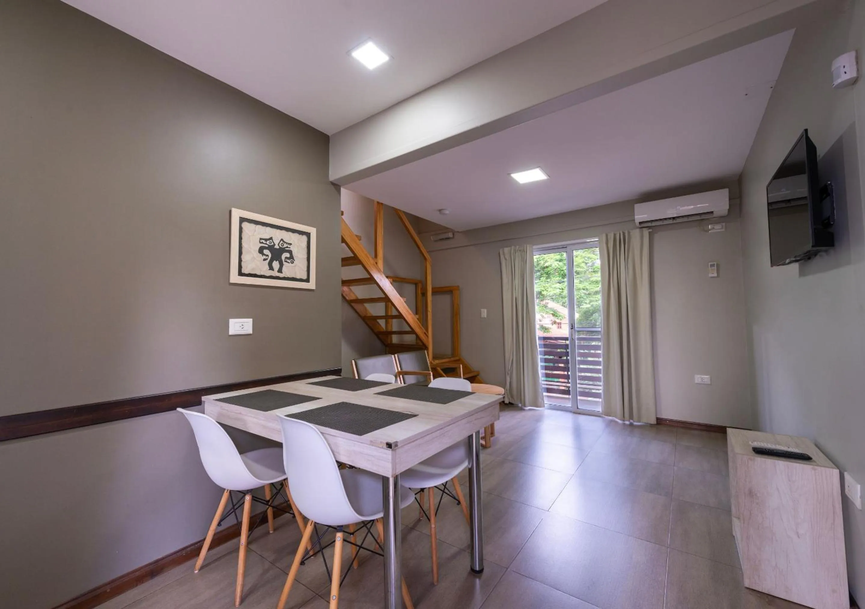 Communal lounge/ TV room in INGA by DOT Suites