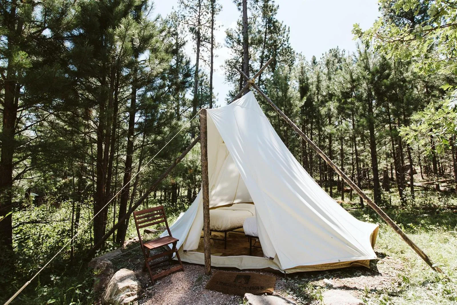 Bed in Under Canvas Mount Rushmore