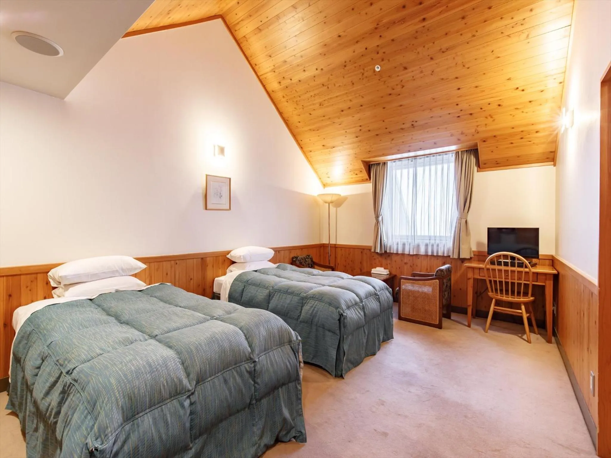 Bed in Kibi Kogen Resort Hotel