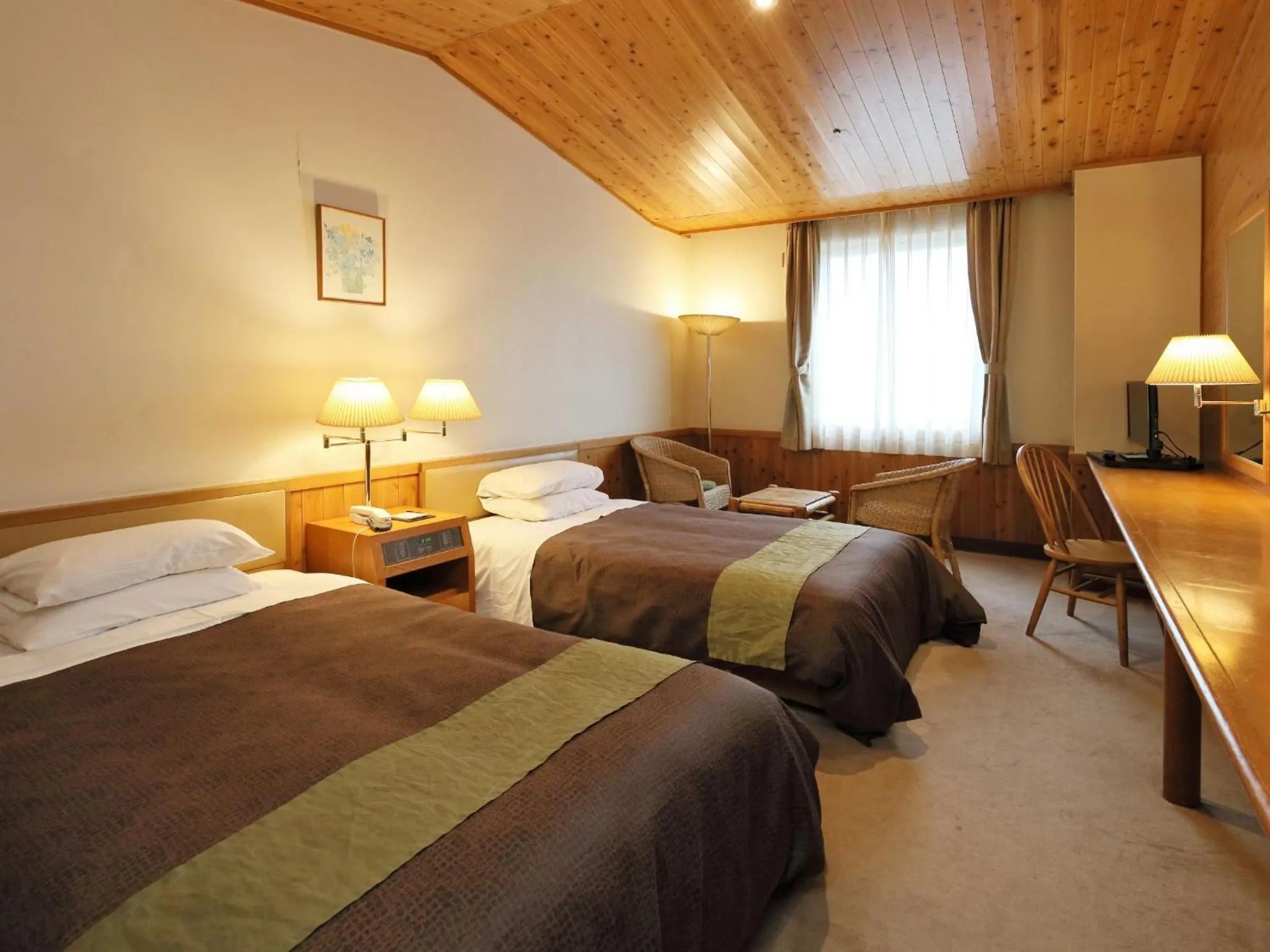 Photo of the whole room, Bed in Kibi Kogen Resort Hotel