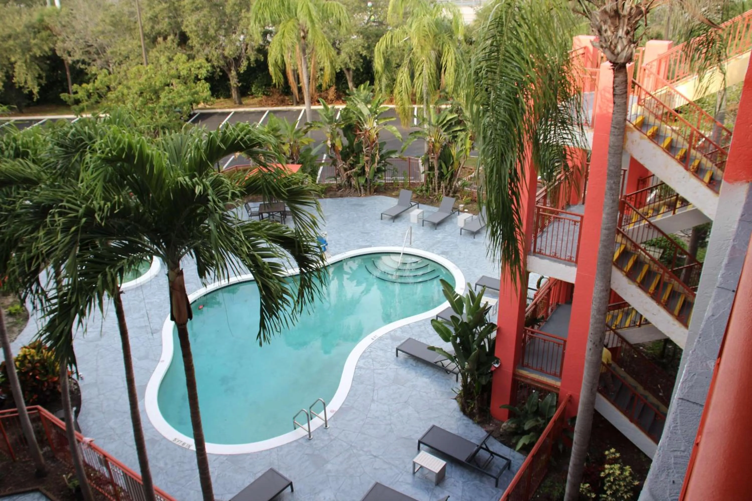 Pool view in Boca Suites Deerfield Beach; SureStay Collection by BW
