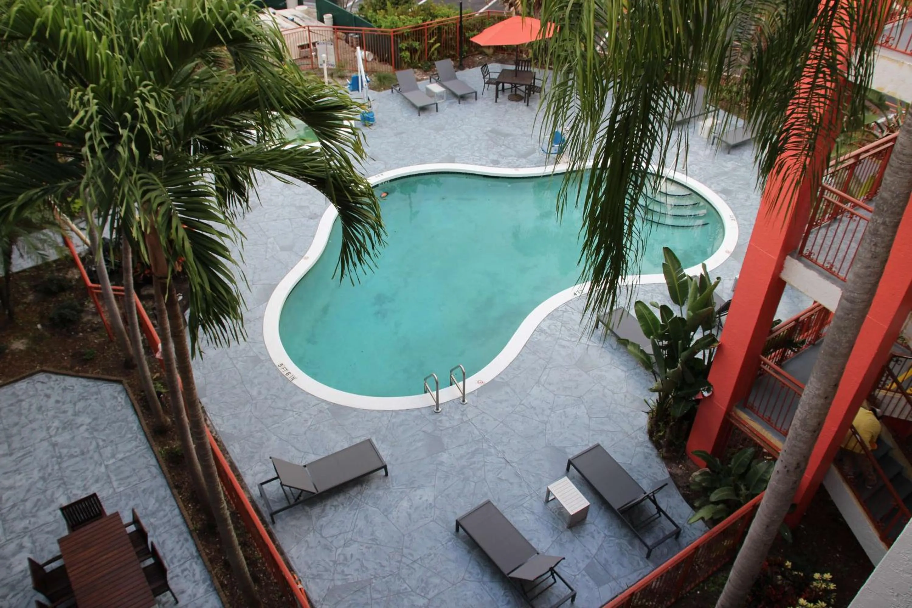Pool view in Boca Suites Deerfield Beach; SureStay Collection by BW