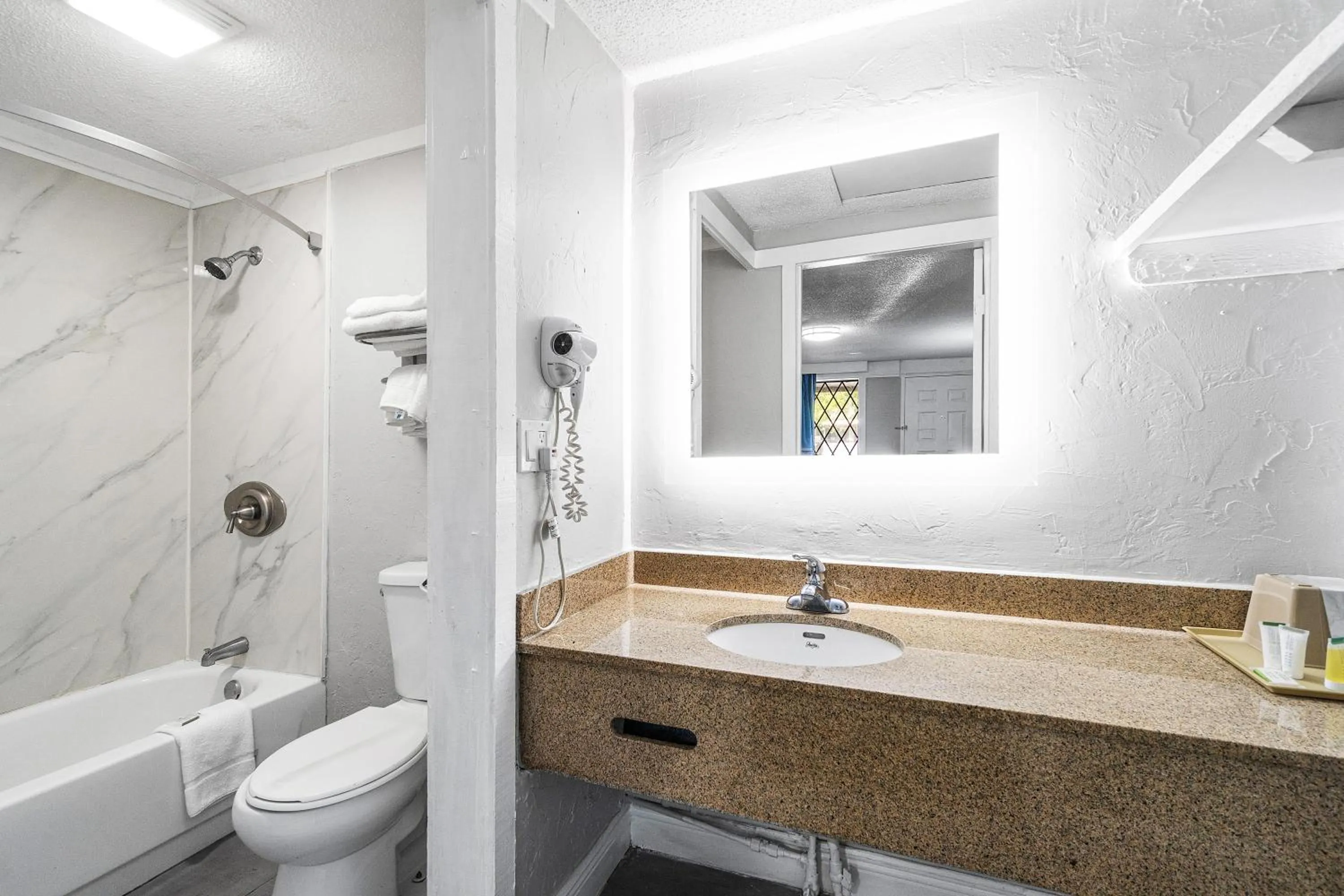 Bathroom in Super 8 by Wyndham Lantana West Palm Beach