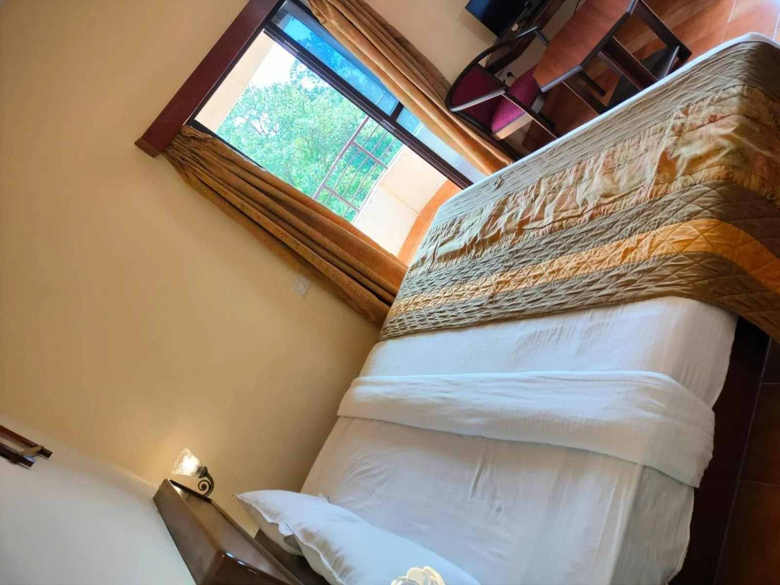 Bed in The Dhanhills - a valley view hotel in panchgani