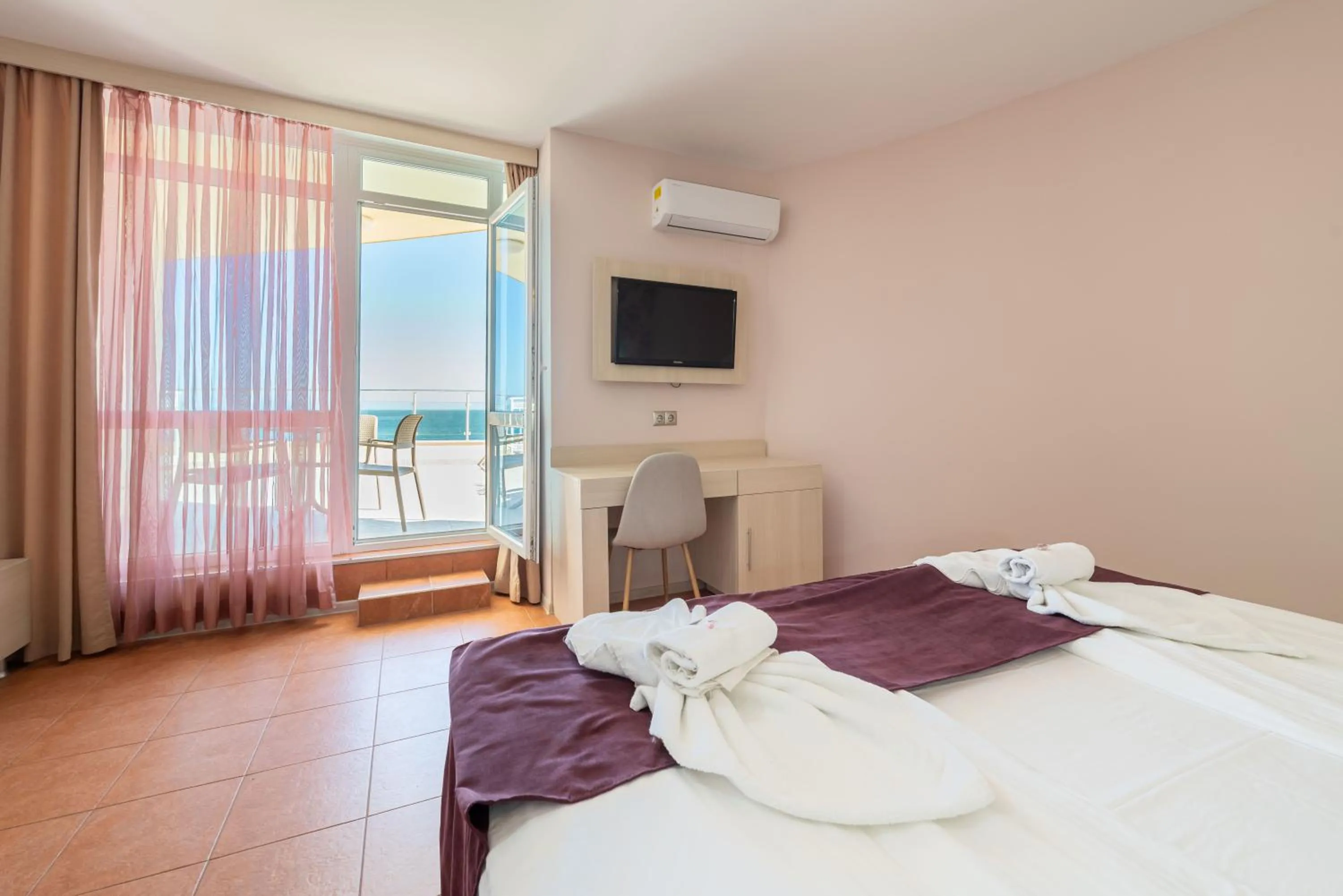 Bed in Aphrodite Beach Hotel