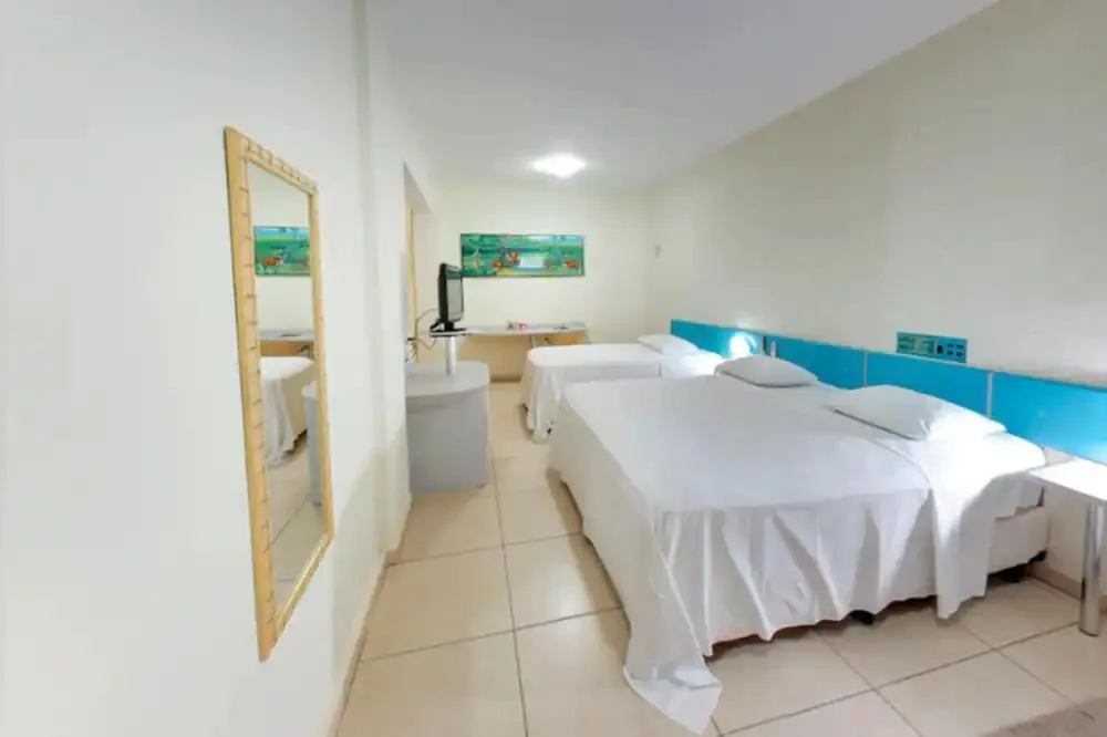 Bed in Amazon Plaza Hotel