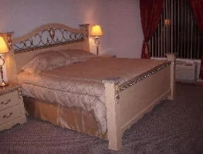 Bed in Chateau Royale Inn