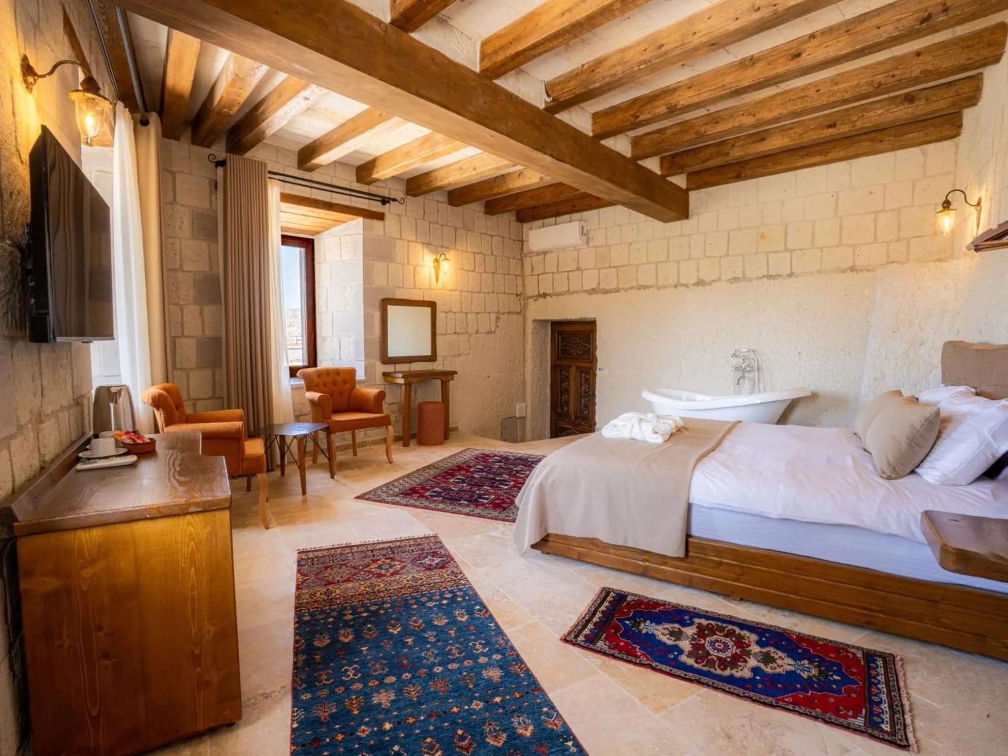 Bed in Tulip Cave Suites