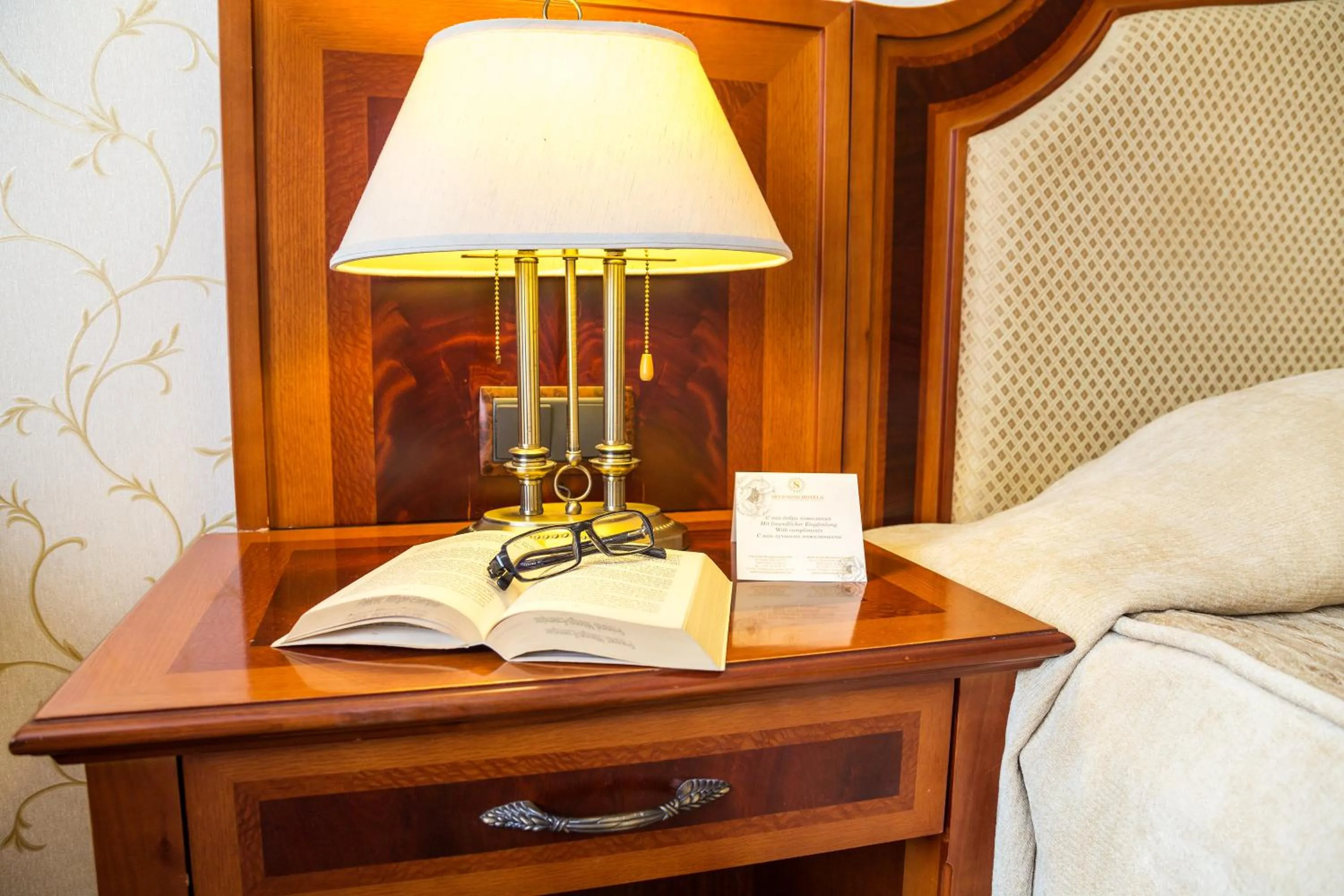 Bed in Romance Hotel and Family Suites