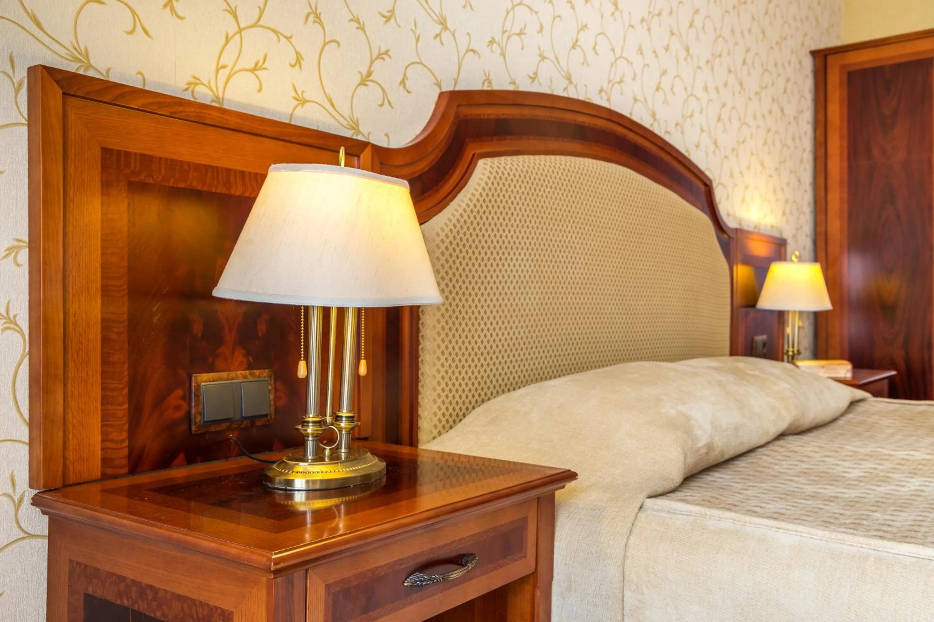 Bed in Romance Hotel and Family Suites