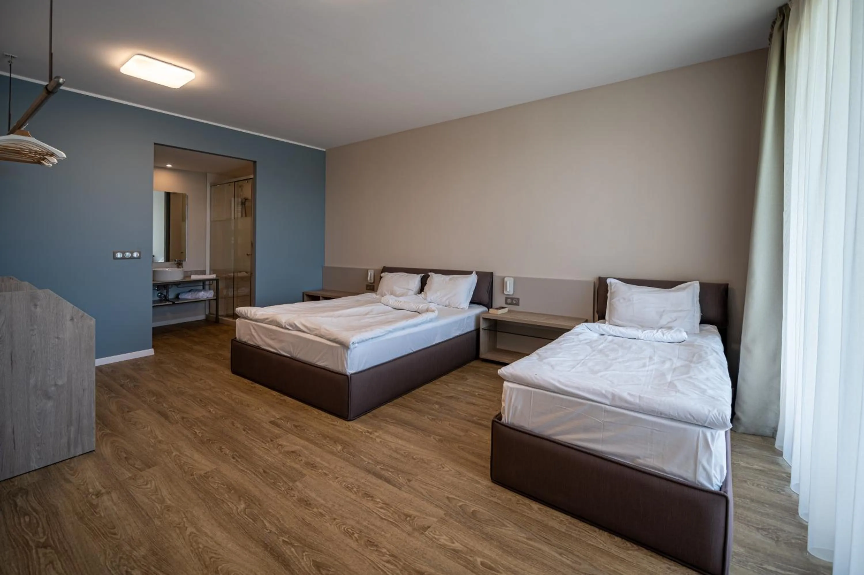 Bed in Romance Hotel and Family Suites