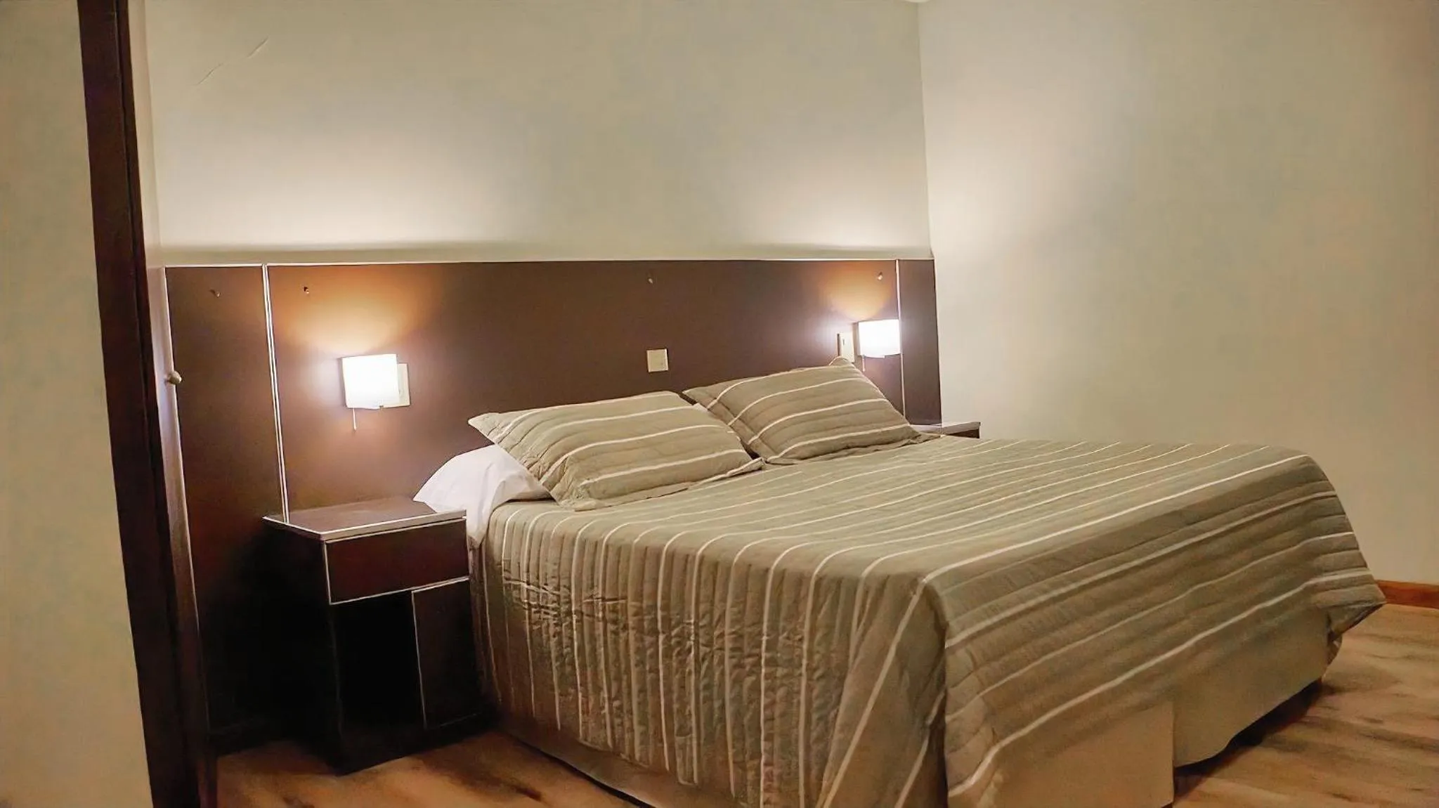 Bed in Cóndor Suites Apart Hotel