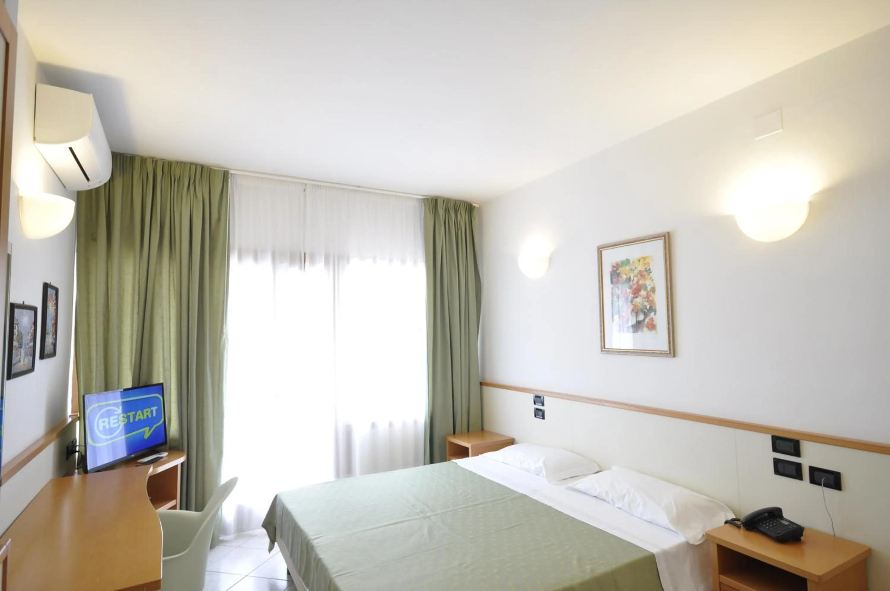 Communal lounge/ TV room, Bed in Hotel degli Ulivi