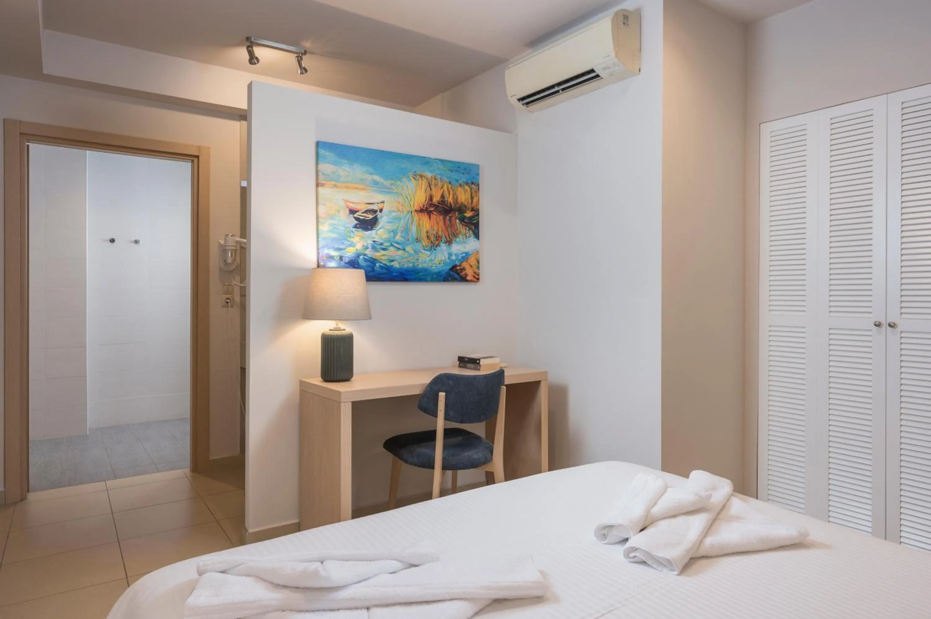 Bed in Trianon Luxury Apartments & Suites