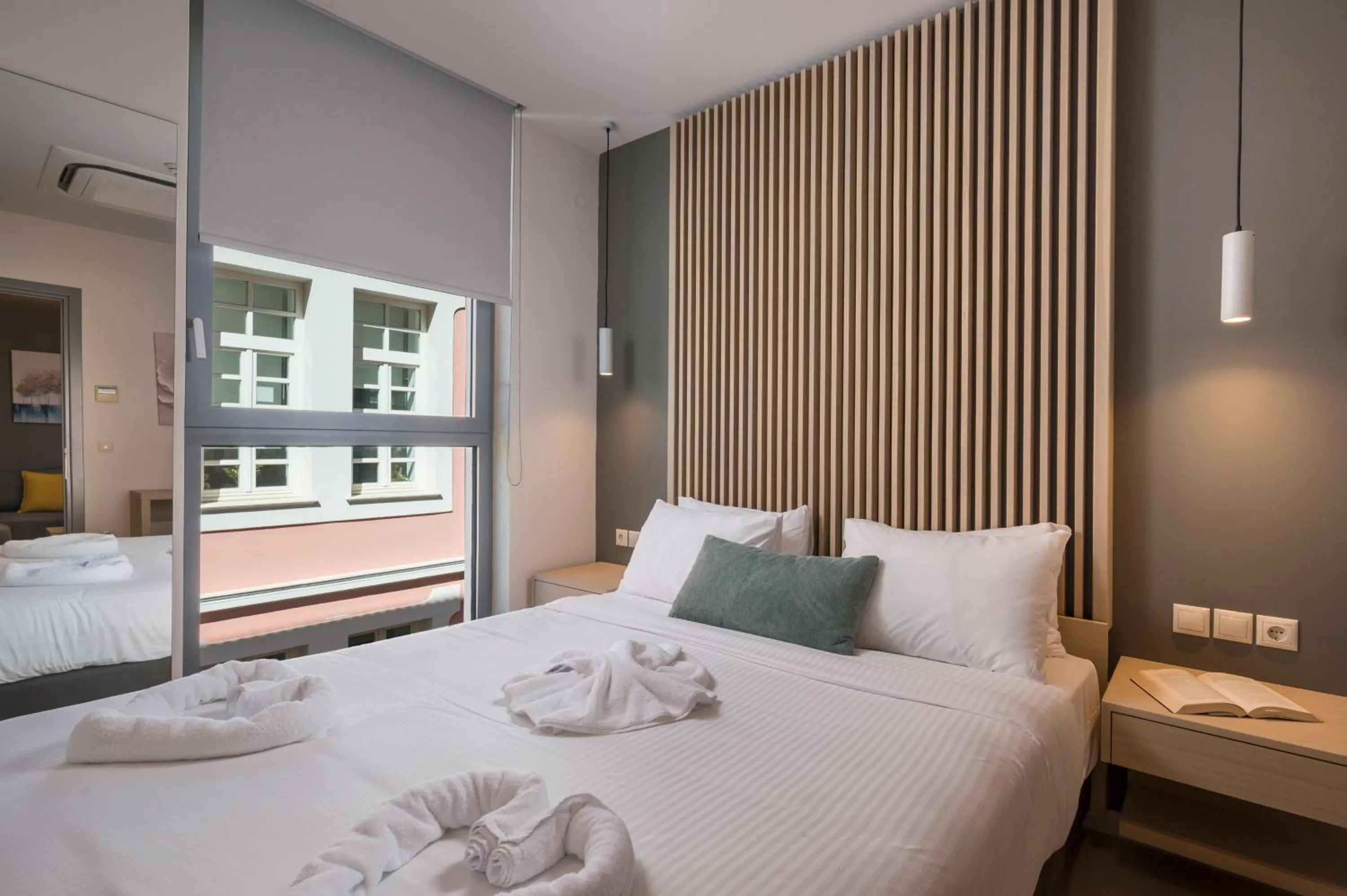 Bed in Trianon Luxury Apartments & Suites