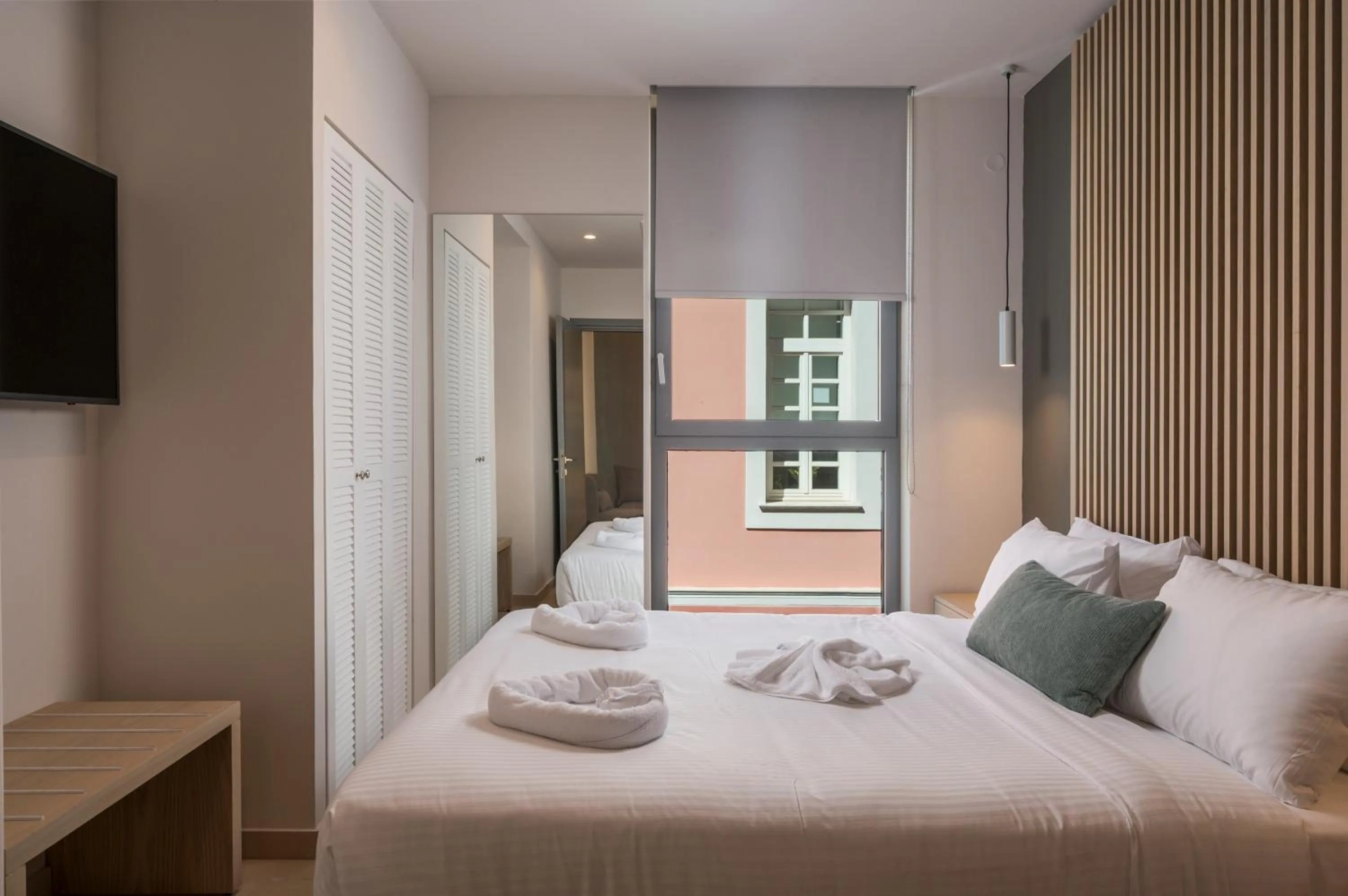 Bed in Trianon Luxury Apartments & Suites