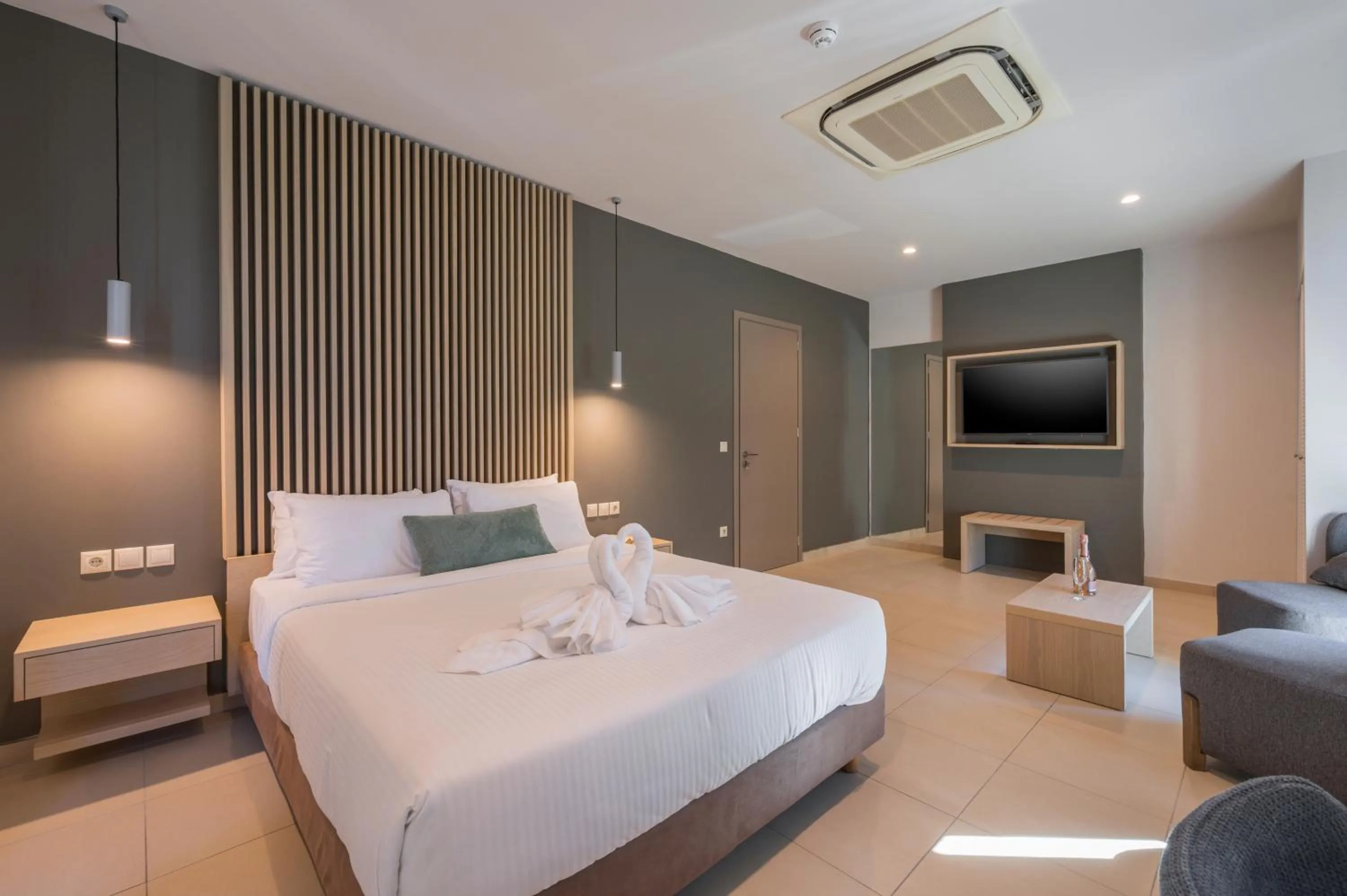 Bed in Trianon Luxury Apartments & Suites