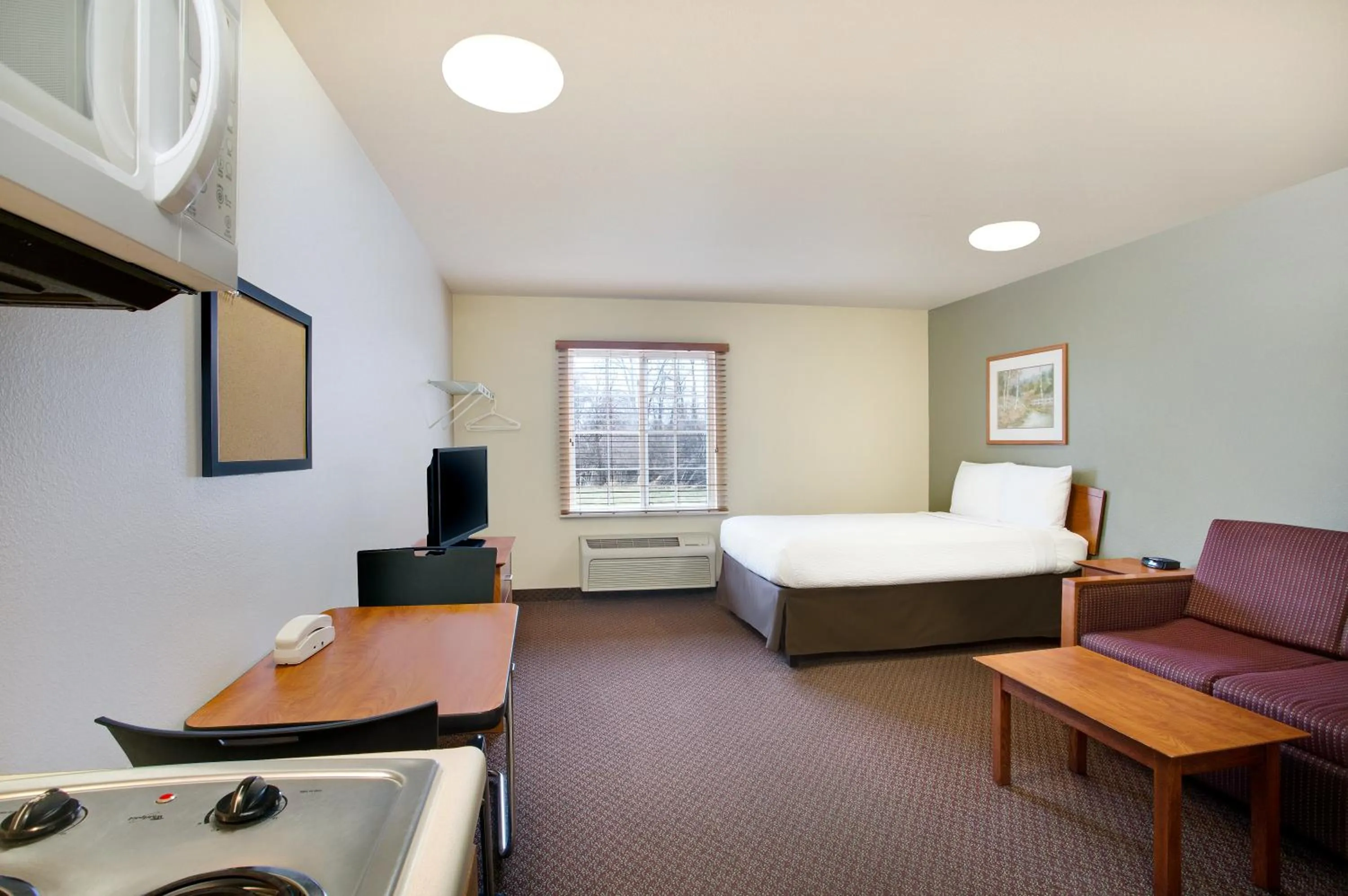 Photo of the whole room, Bed in WoodSpring Suites Cincinnati Fairfield