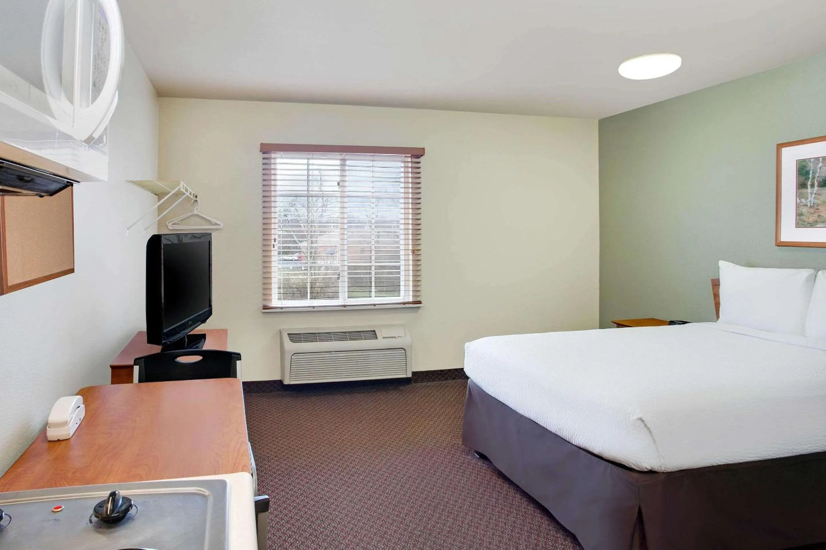 Photo of the whole room, Bed in WoodSpring Suites Cincinnati Fairfield