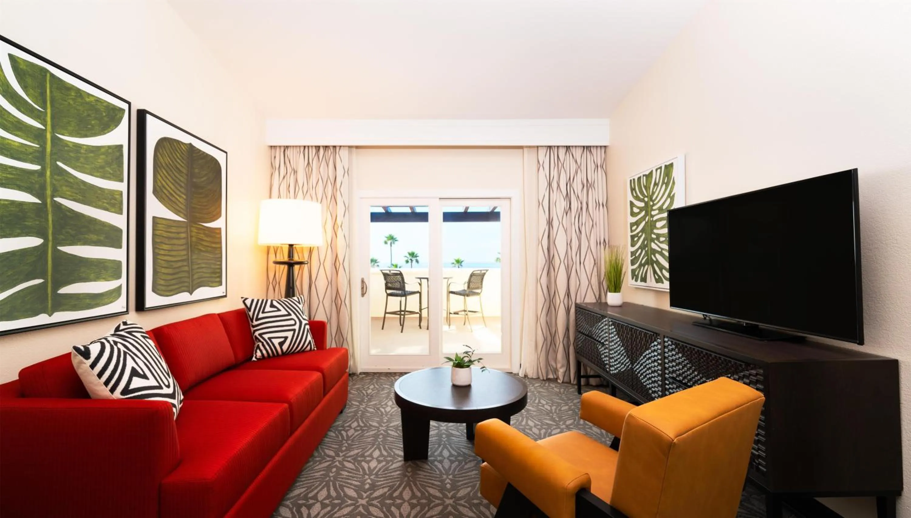 Living room in Zachari Dunes on Mandalay Beach, Curio Collection by Hilton