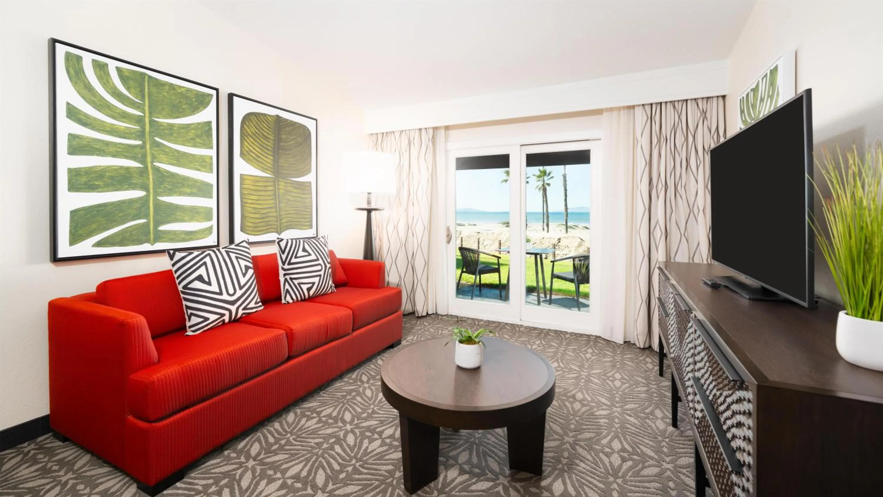 Living room in Zachari Dunes on Mandalay Beach, Curio Collection by Hilton