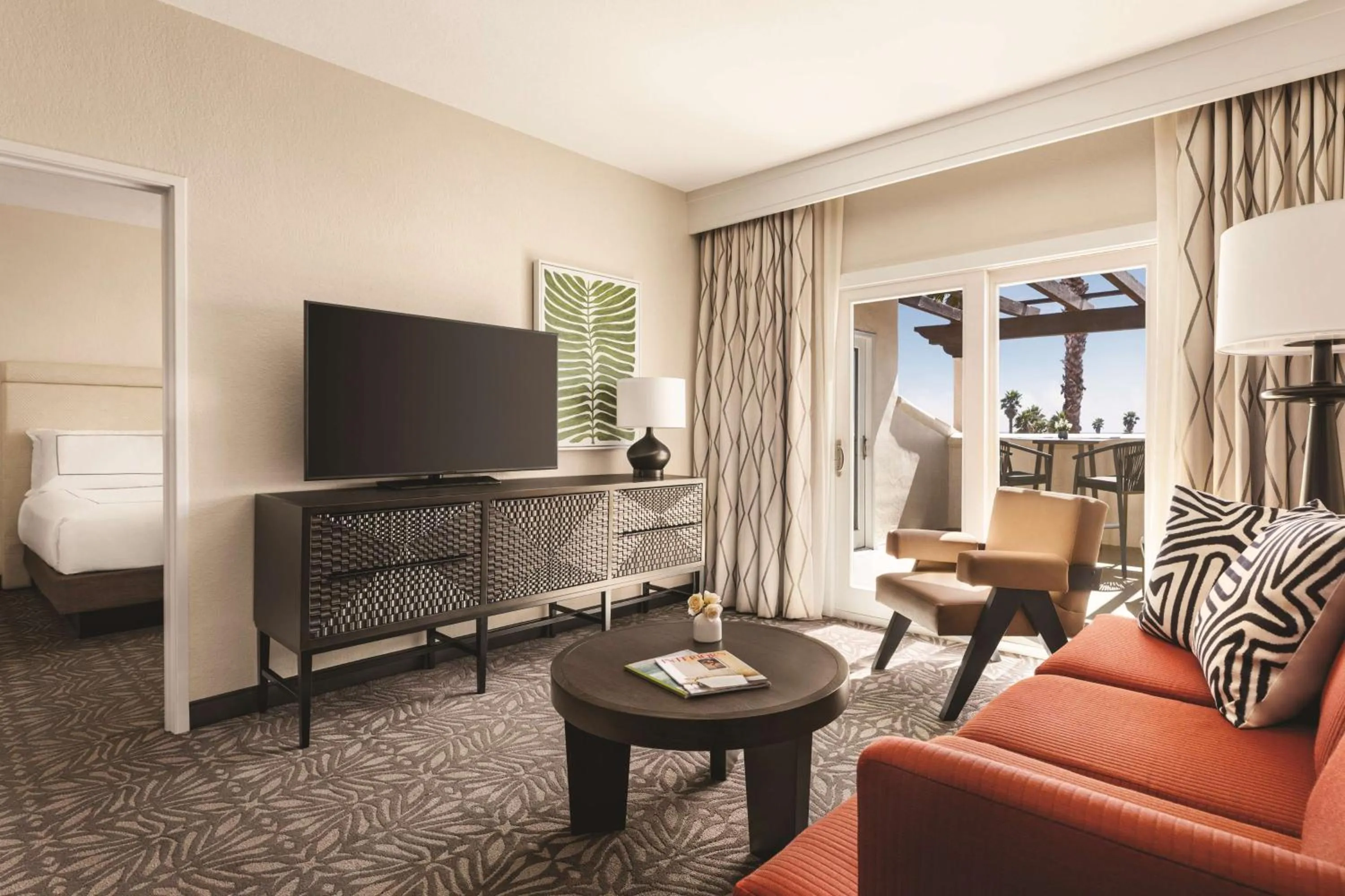 Living room in Zachari Dunes on Mandalay Beach, Curio Collection by Hilton