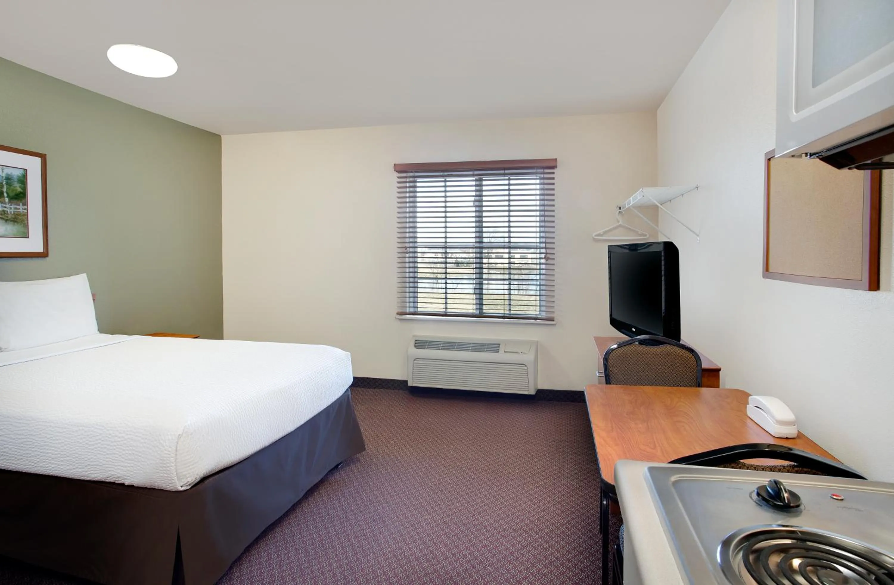 Bed in WoodSpring Suites Fort Wayne