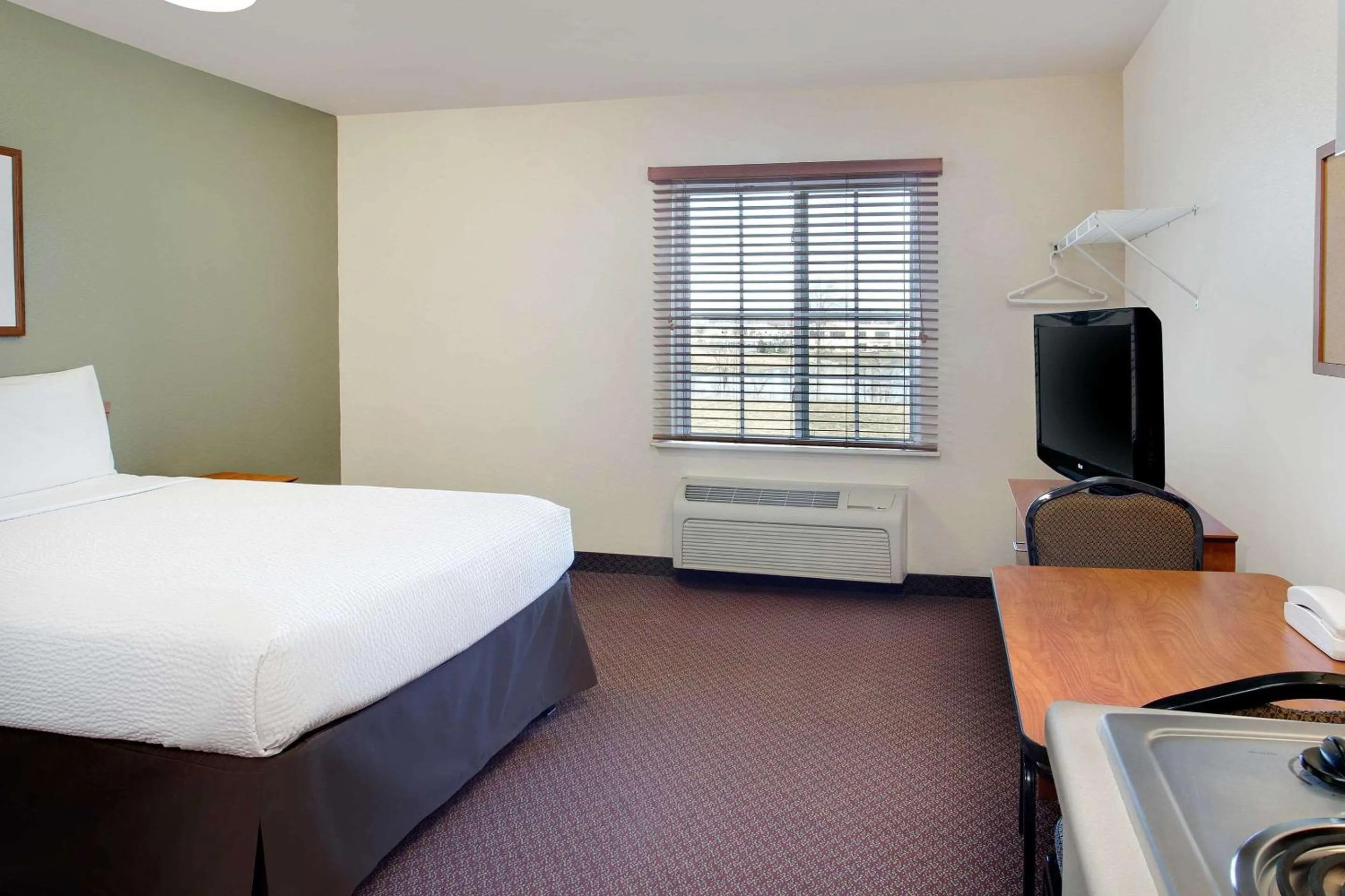 Photo of the whole room, Bed in WoodSpring Suites Fort Wayne