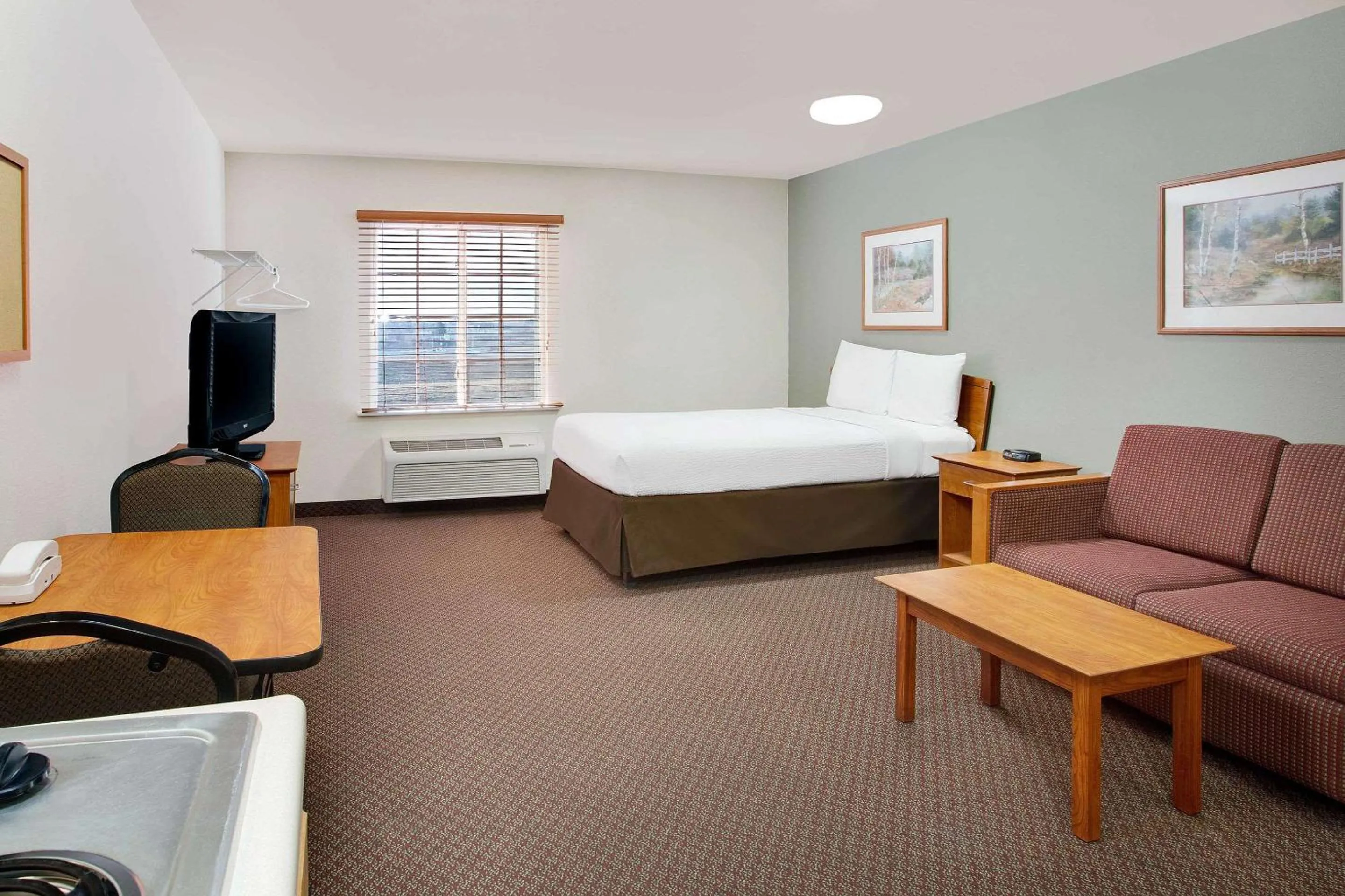 Photo of the whole room, Bed in WoodSpring Suites Fort Wayne