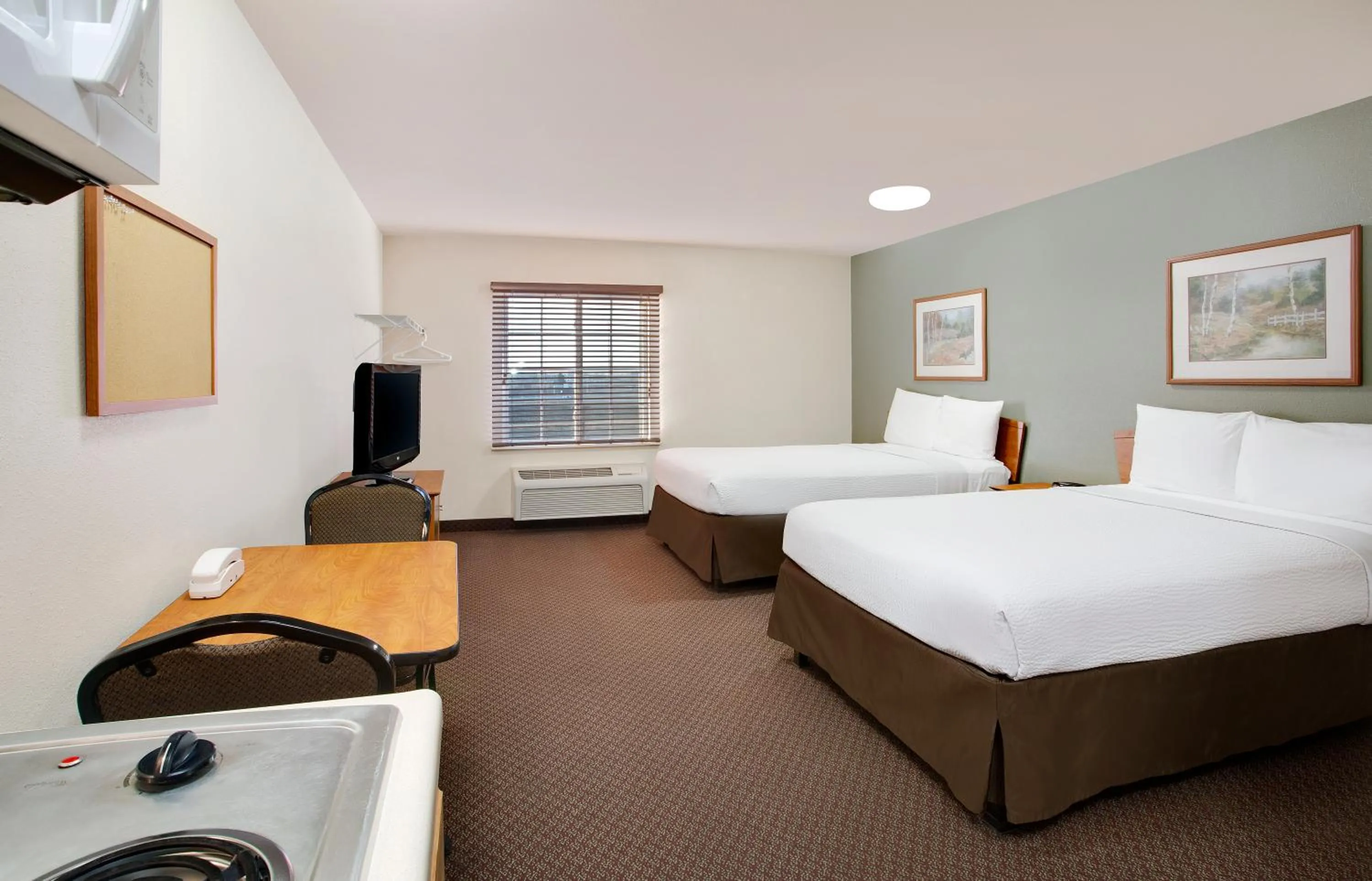 Bed in WoodSpring Suites Fort Wayne