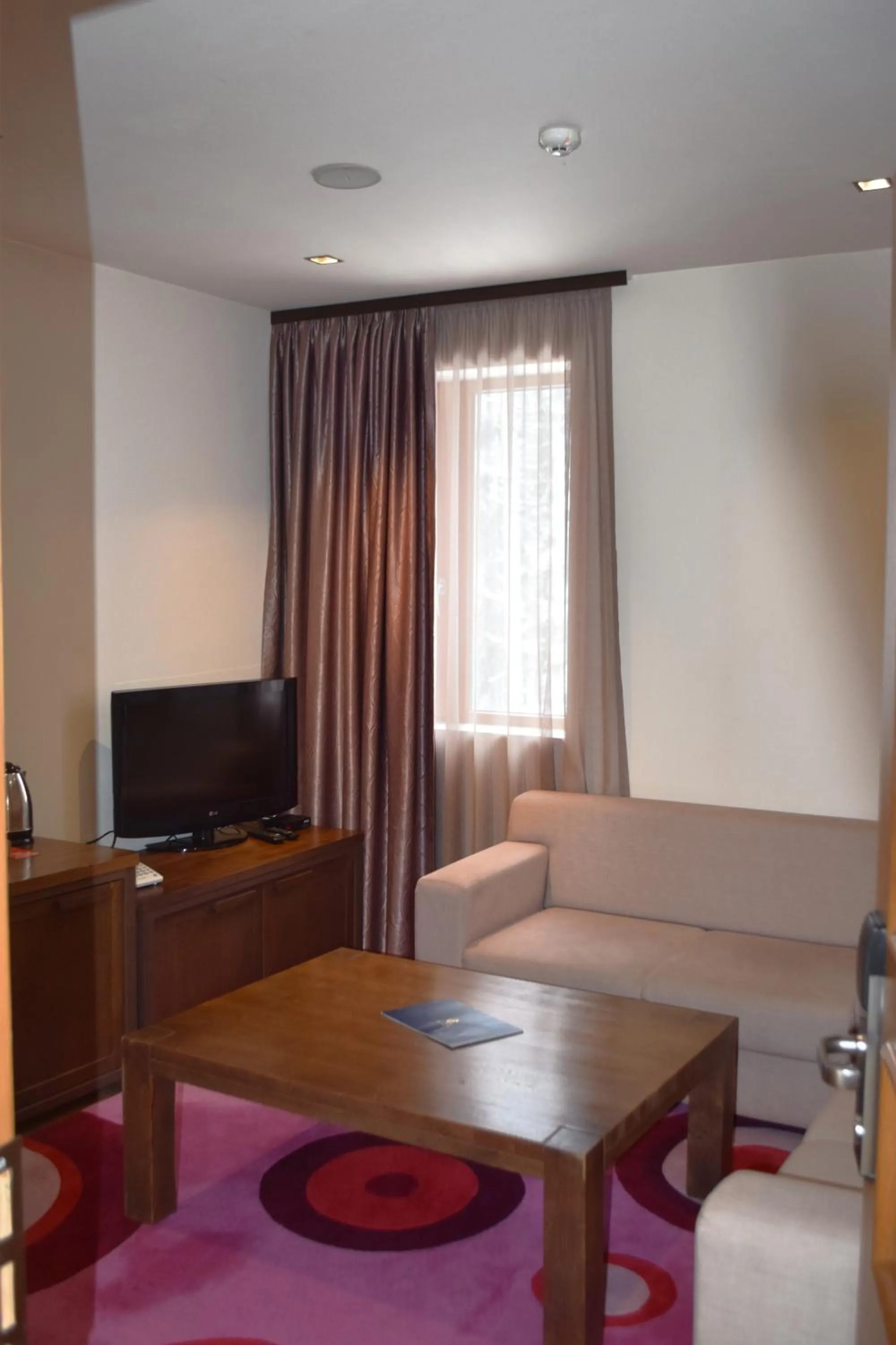 Communal lounge/ TV room in The Lodge Hotel