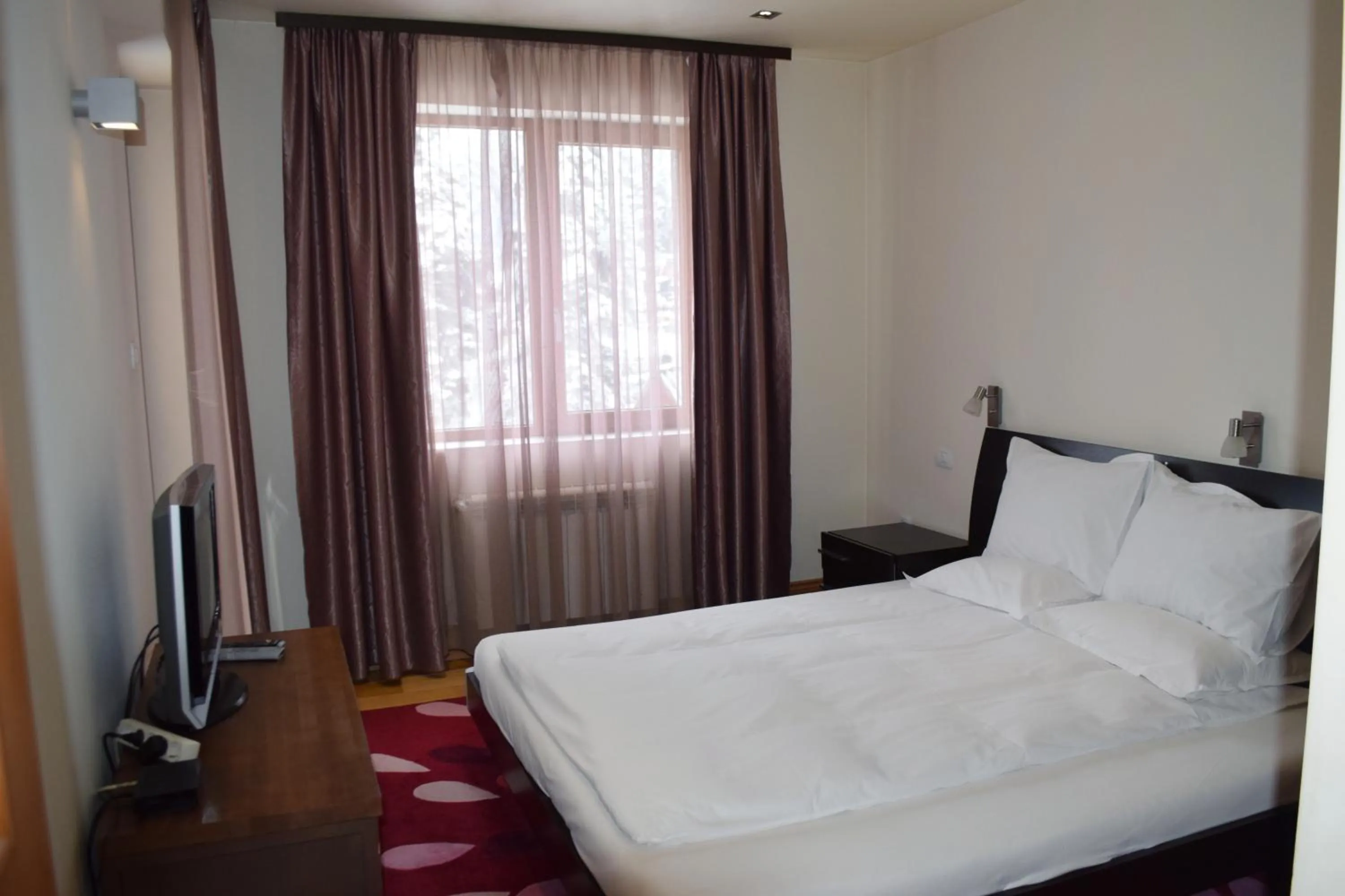 Bed in The Lodge Hotel