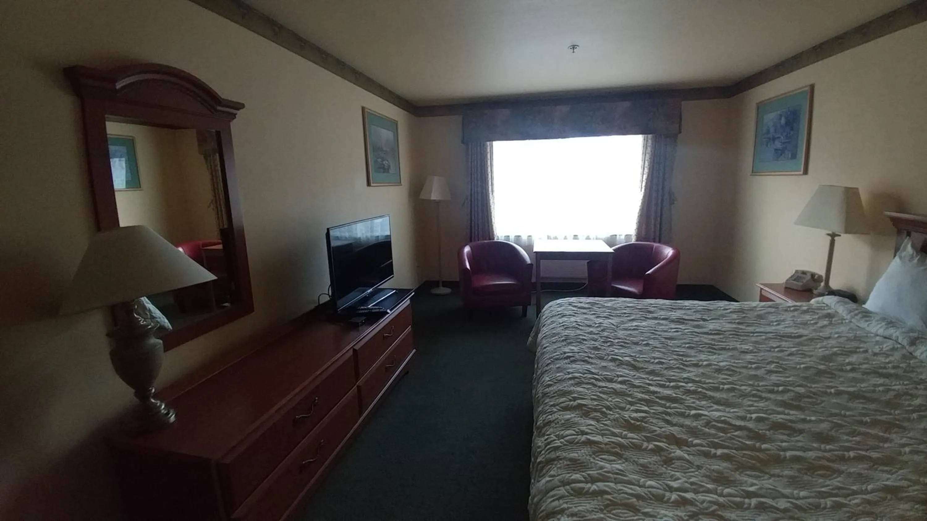 Bed in Palace Inn & Suites