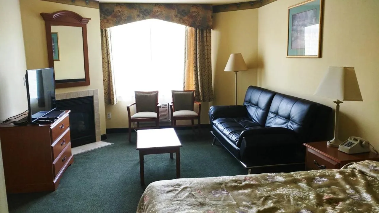 Bed in Palace Inn & Suites