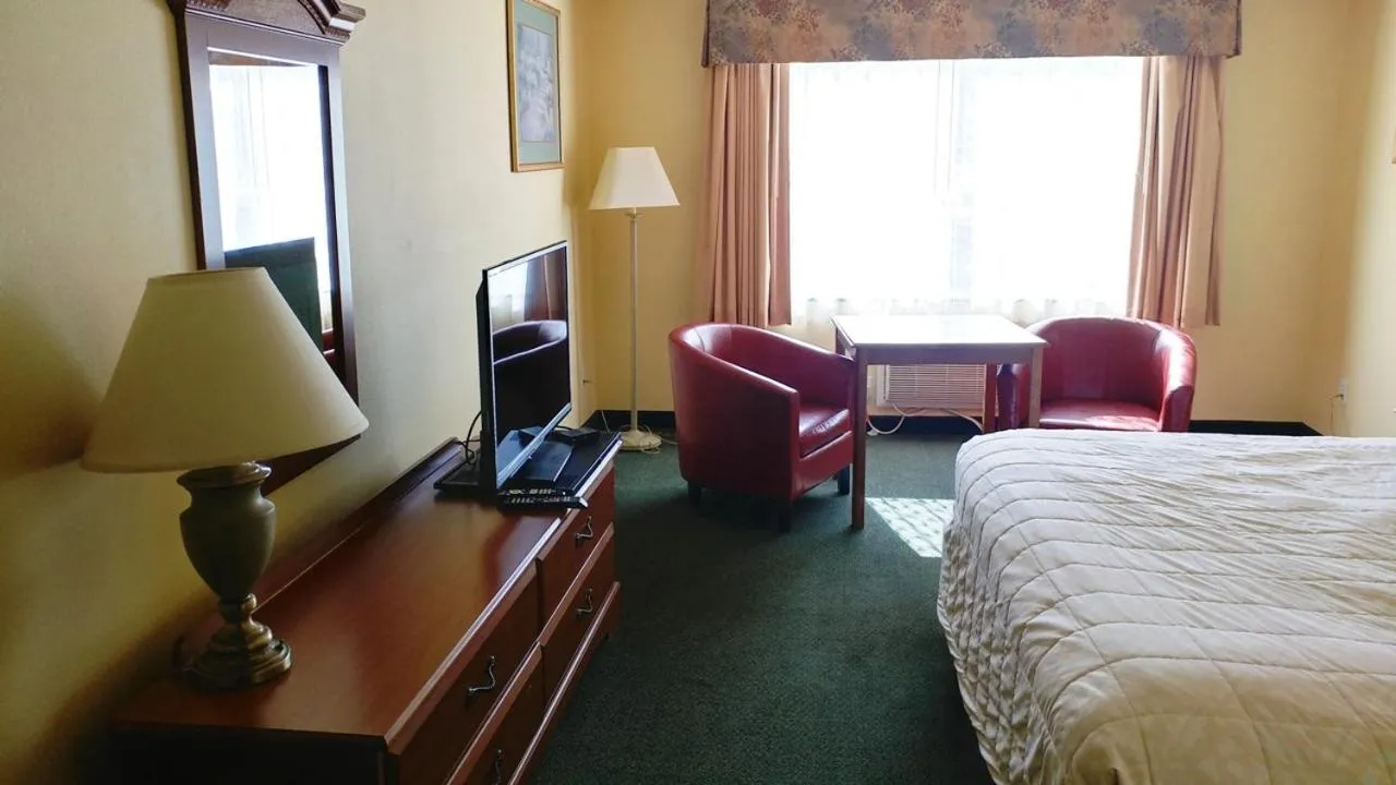 Bed in Palace Inn & Suites