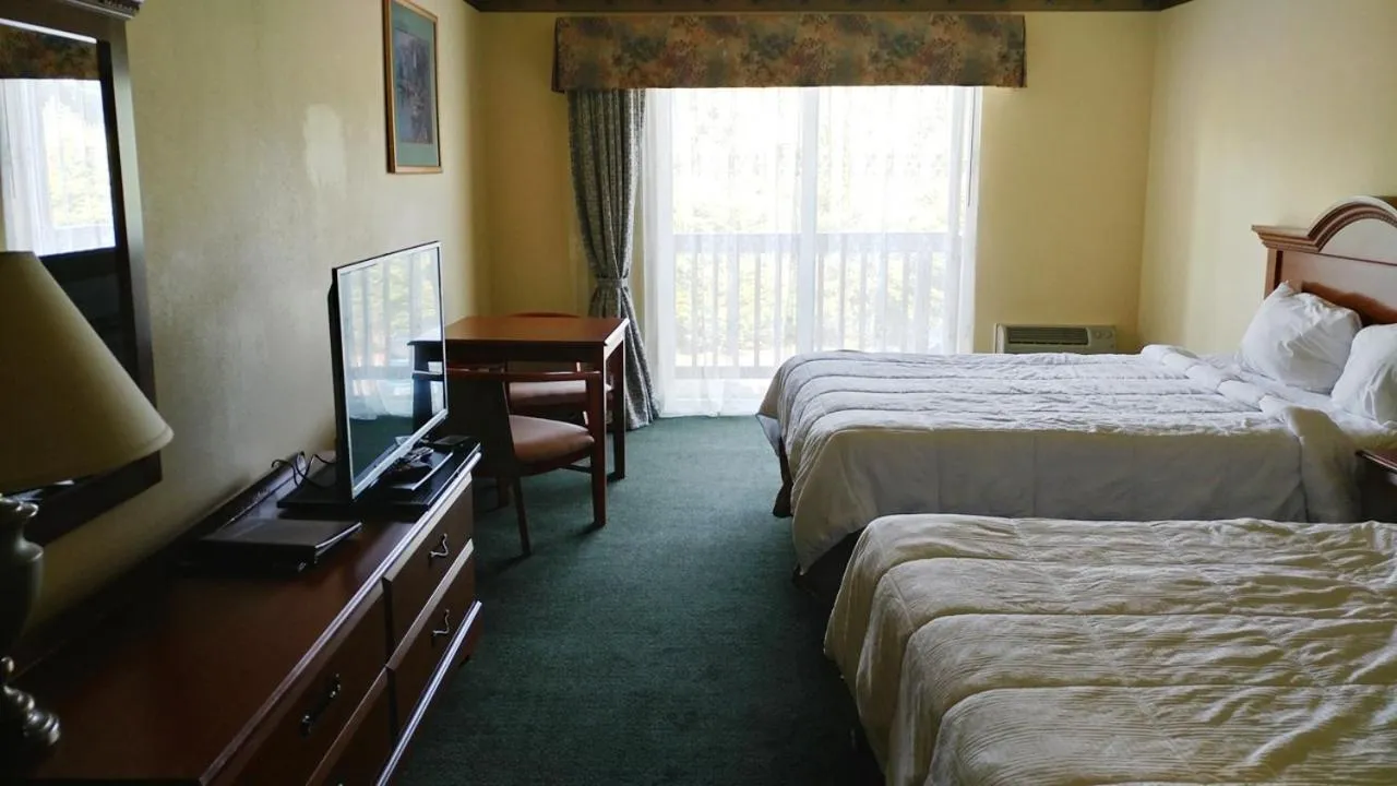 Bed in Palace Inn & Suites