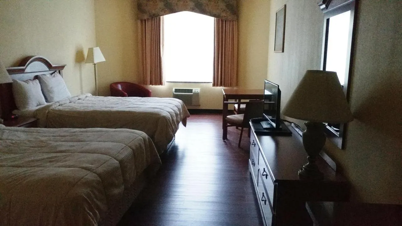 Bed in Palace Inn & Suites