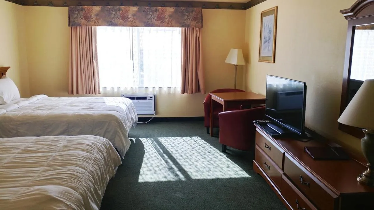 Bed in Palace Inn & Suites