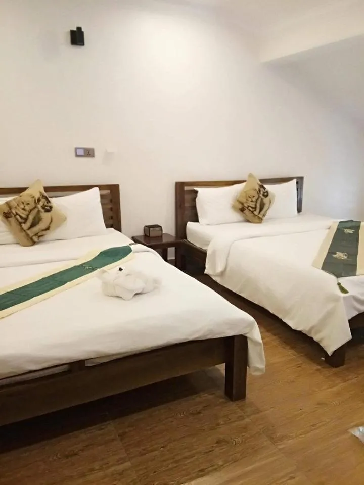 Bed in TWIN HOME Guesthouse