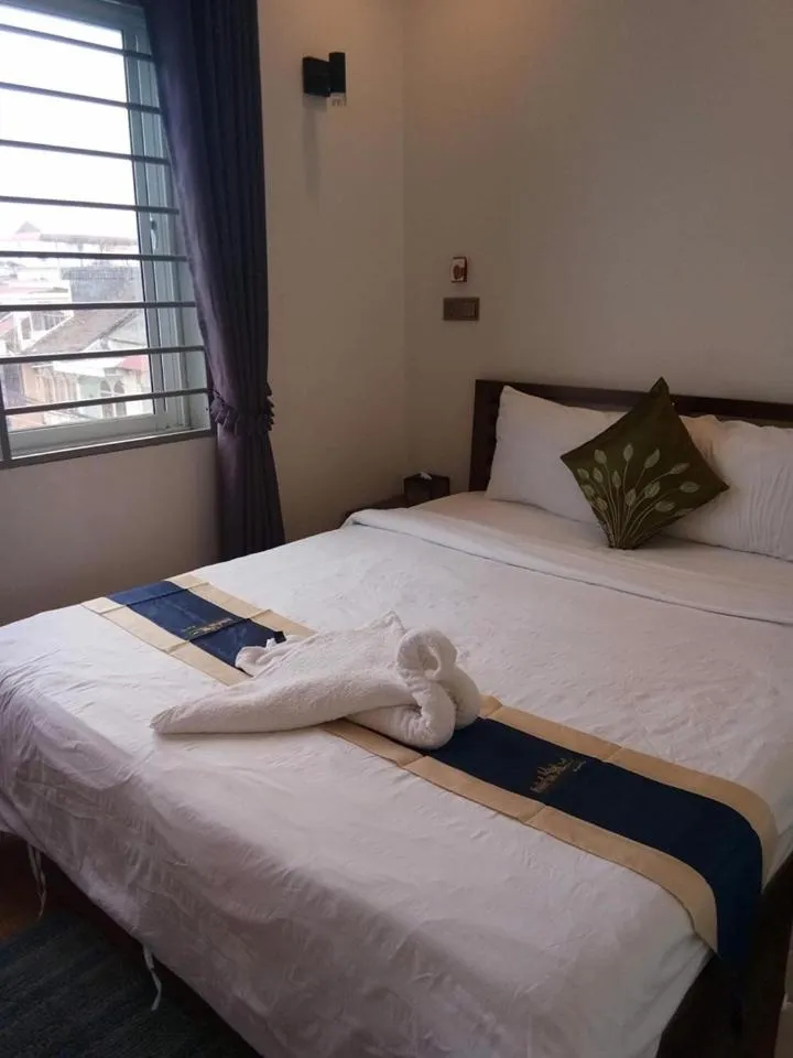 Bed in TWIN HOME Guesthouse