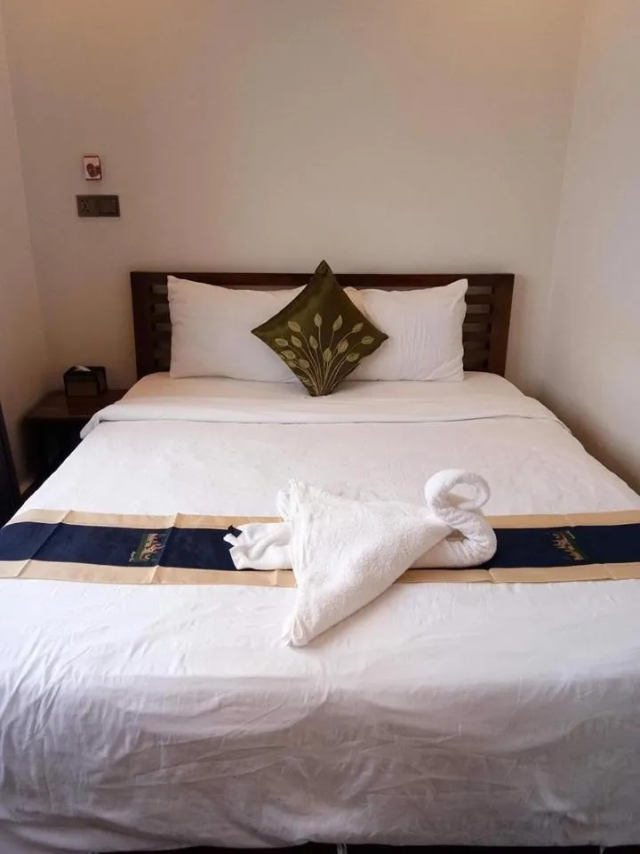 Bed in TWIN HOME Guesthouse