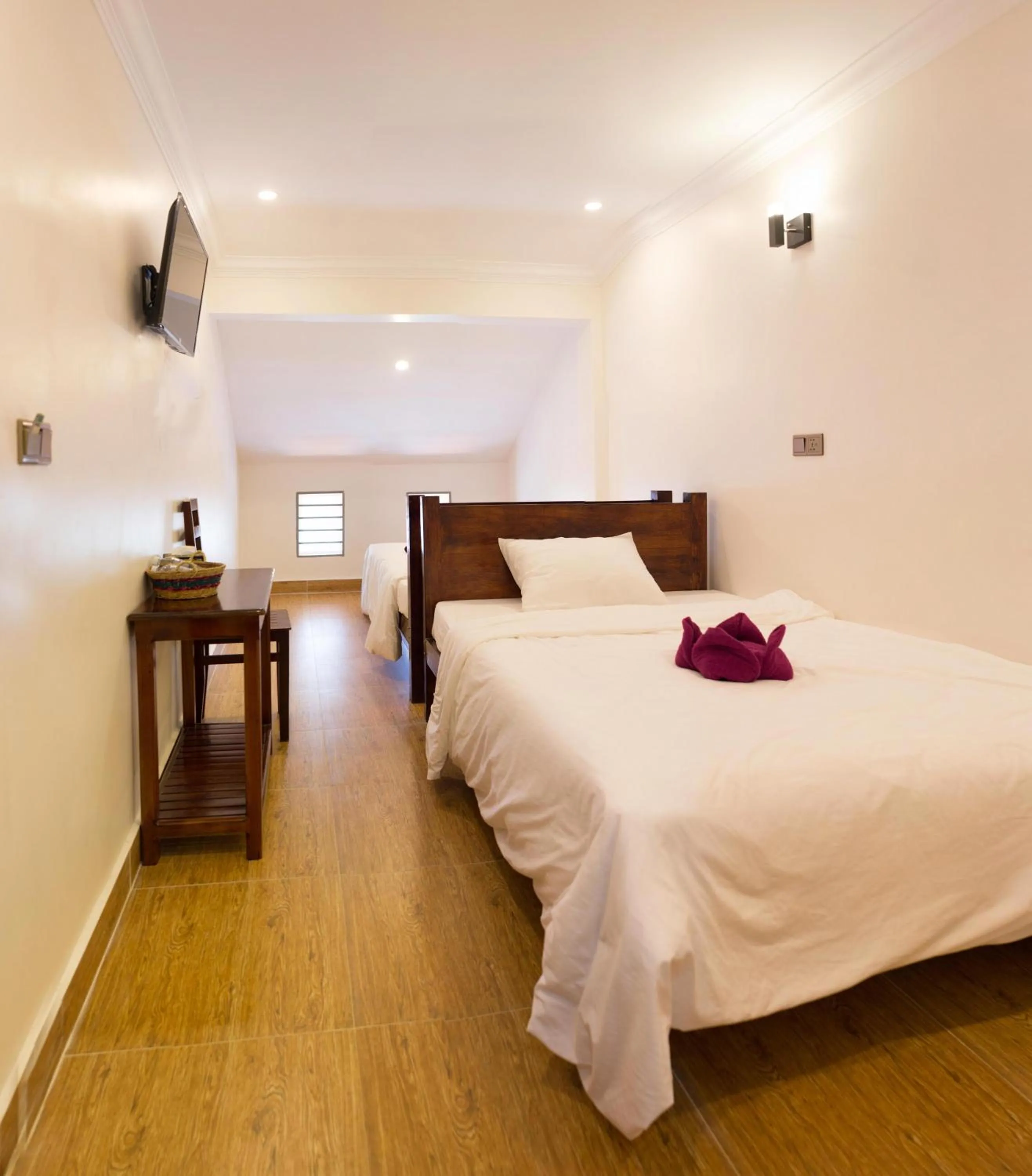 Bed in TWIN HOME Guesthouse