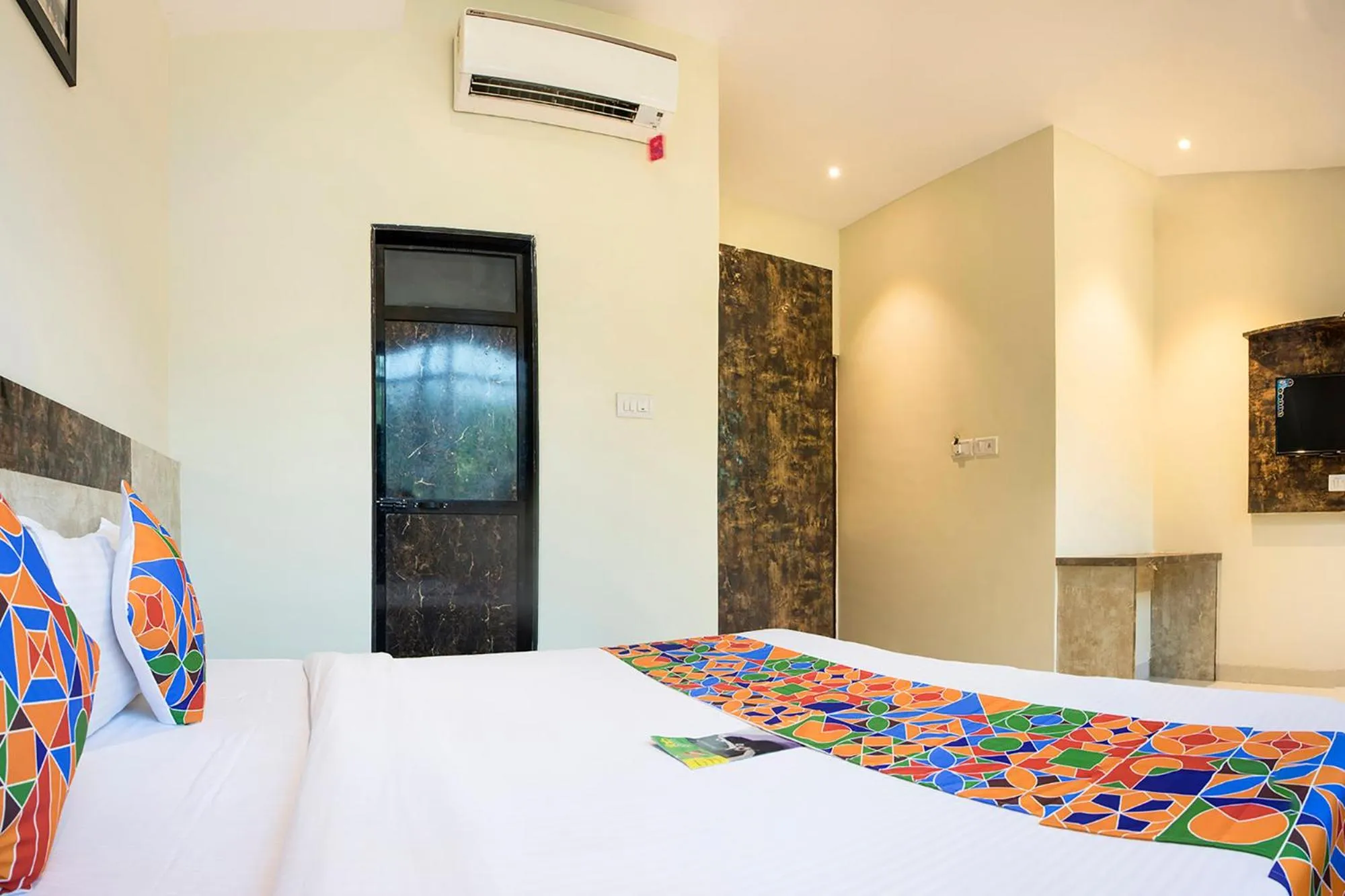 Bed in FabHotel Embassy Grand