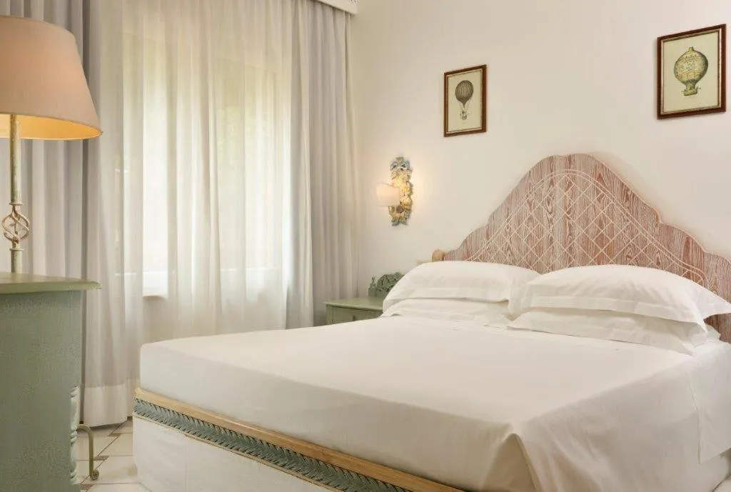 Bed in Golf Hotel Punta Ala